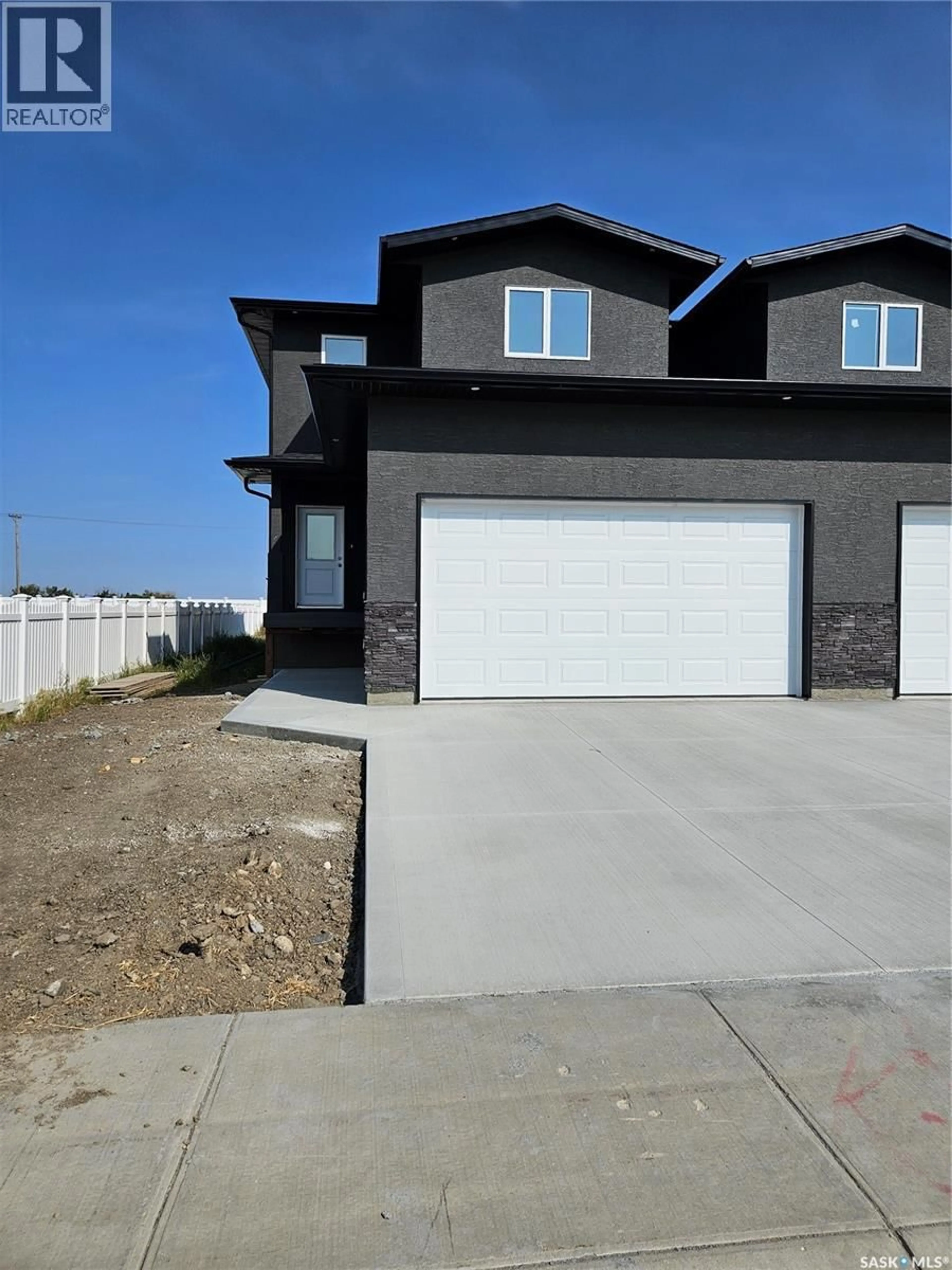 Home with vinyl exterior material, street for 846 DELAET BAY, Warman Saskatchewan S0K0A1
