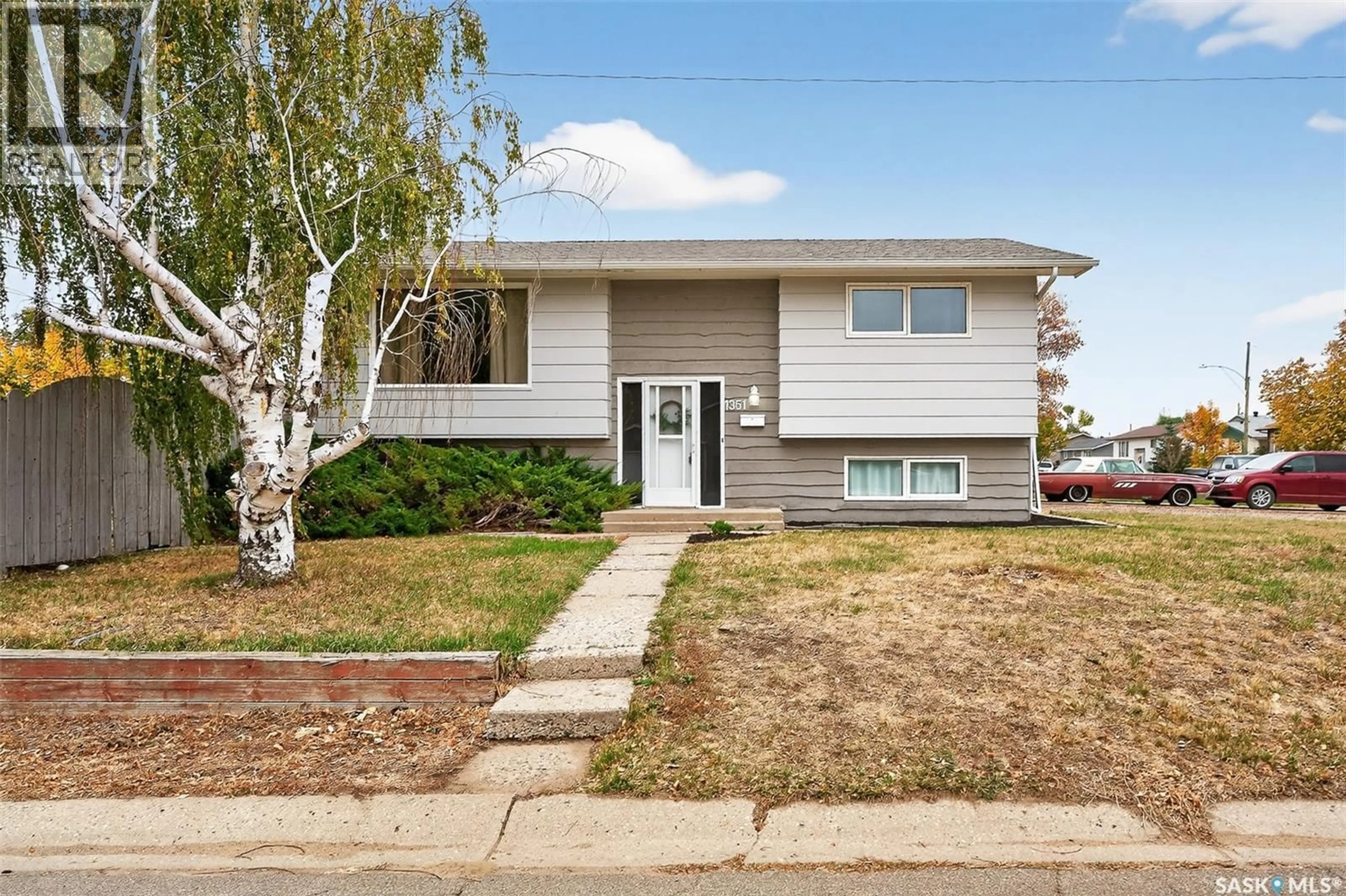 Home with vinyl exterior material, street for 1351 14TH AVENUE, Moose Jaw Saskatchewan S6H0S9