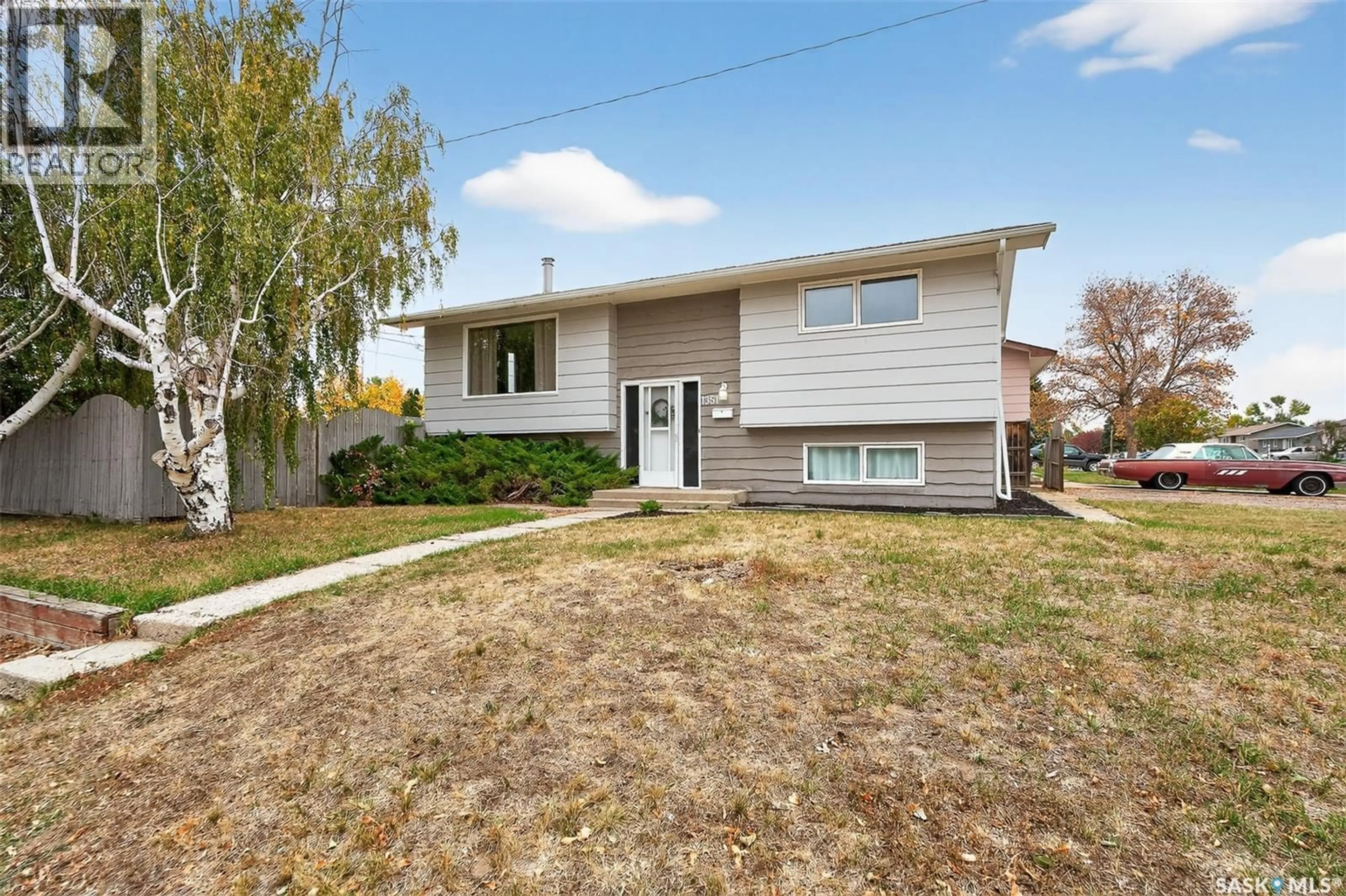 Home with vinyl exterior material, street for 1351 14TH AVENUE, Moose Jaw Saskatchewan S6H0S9