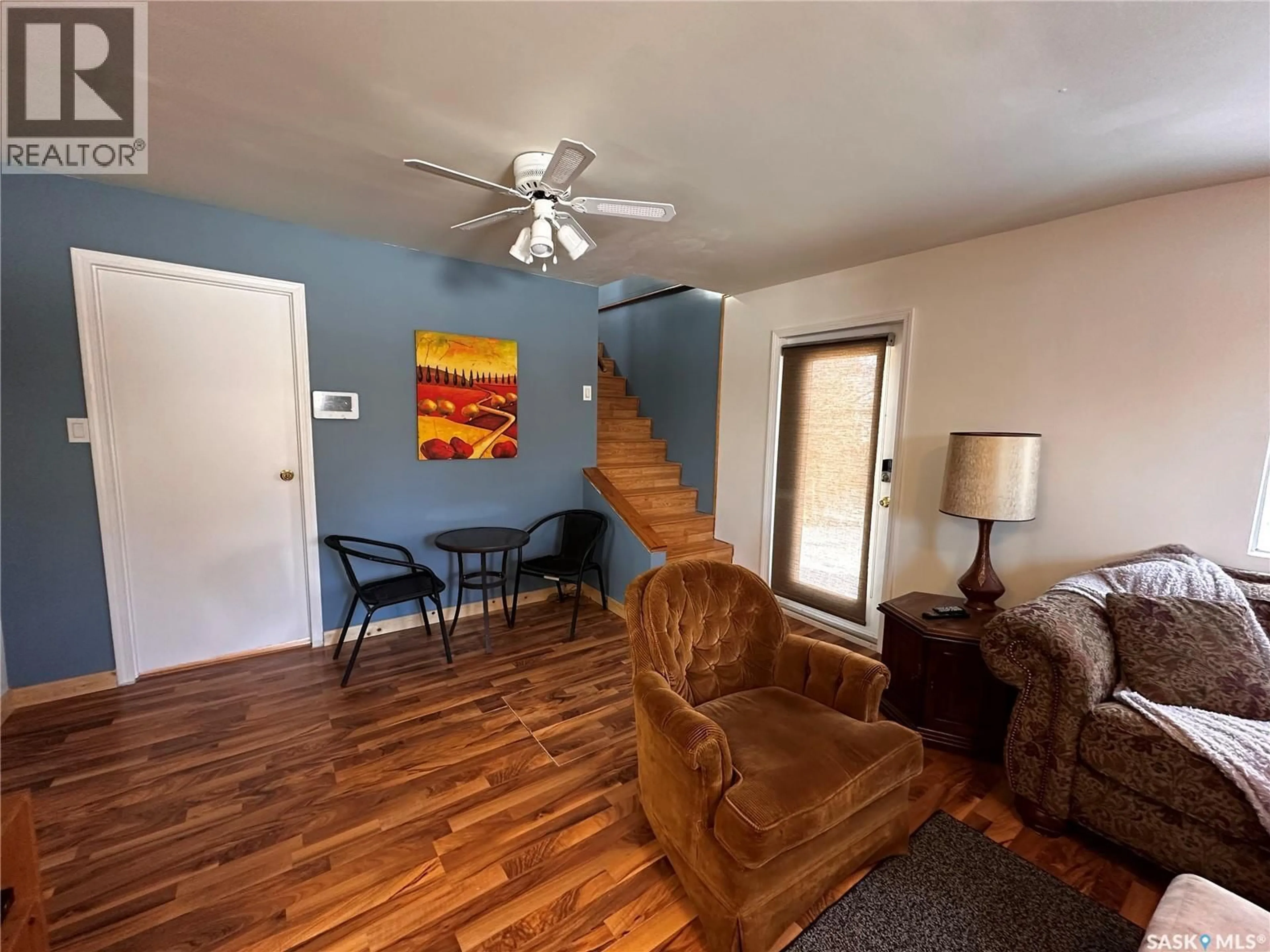 Living room with furniture, wood/laminate floor for 101 1ST AVENUE, Lajord Rm No. 128 Saskatchewan S0G1B0