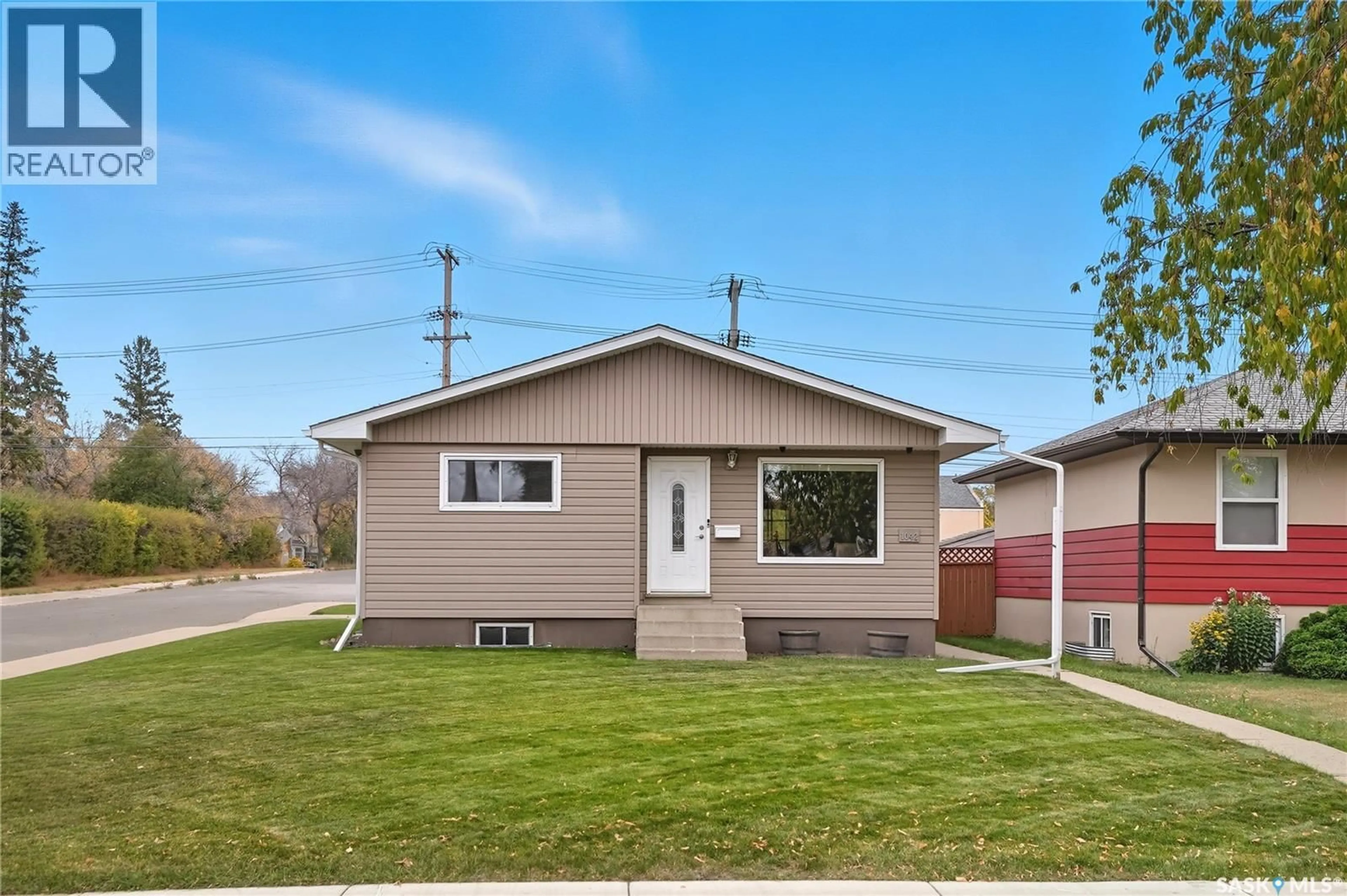 Home with vinyl exterior material, street for 1042 J AVENUE, Saskatoon Saskatchewan S7L2L4