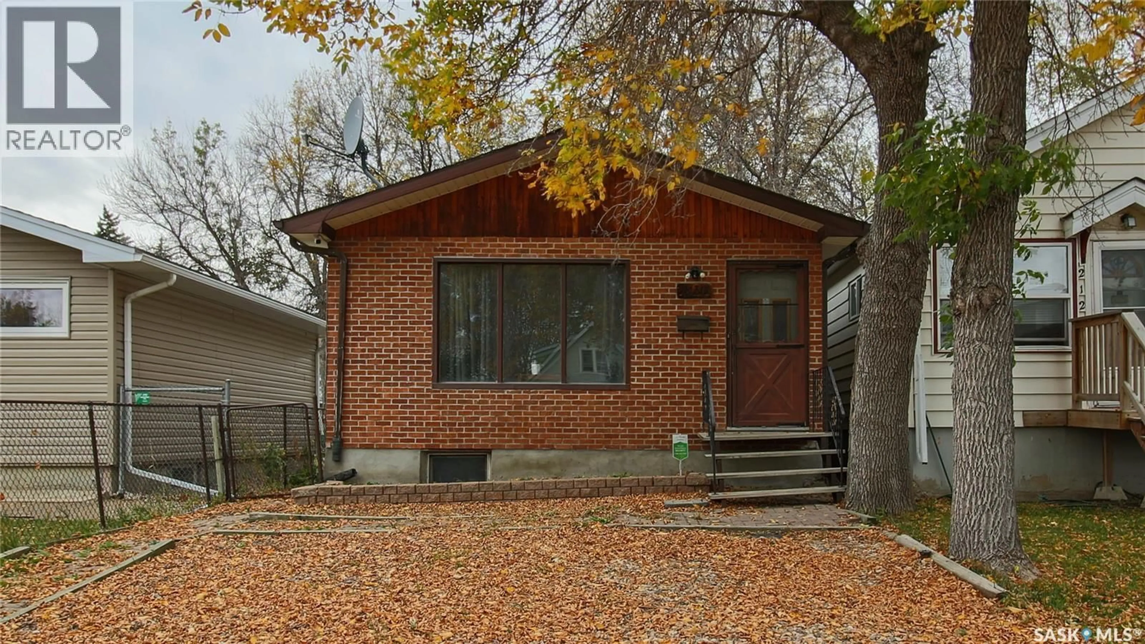 Home with brick exterior material, street for 2130 ATKINSON STREET, Regina Saskatchewan S4N3W9