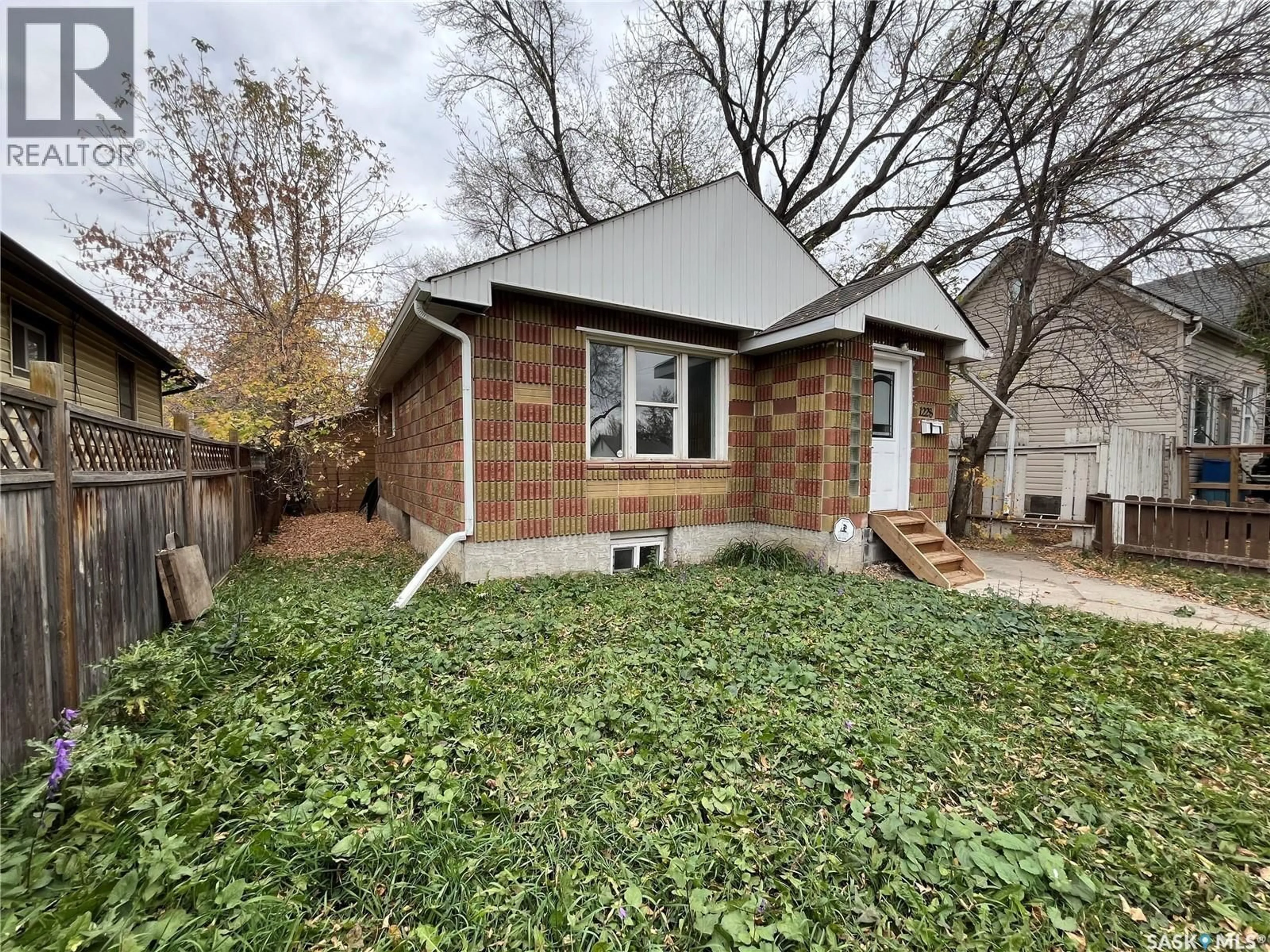Home with brick exterior material, street for 1228 1ST AVENUE, Saskatoon Saskatchewan S7K1Y6