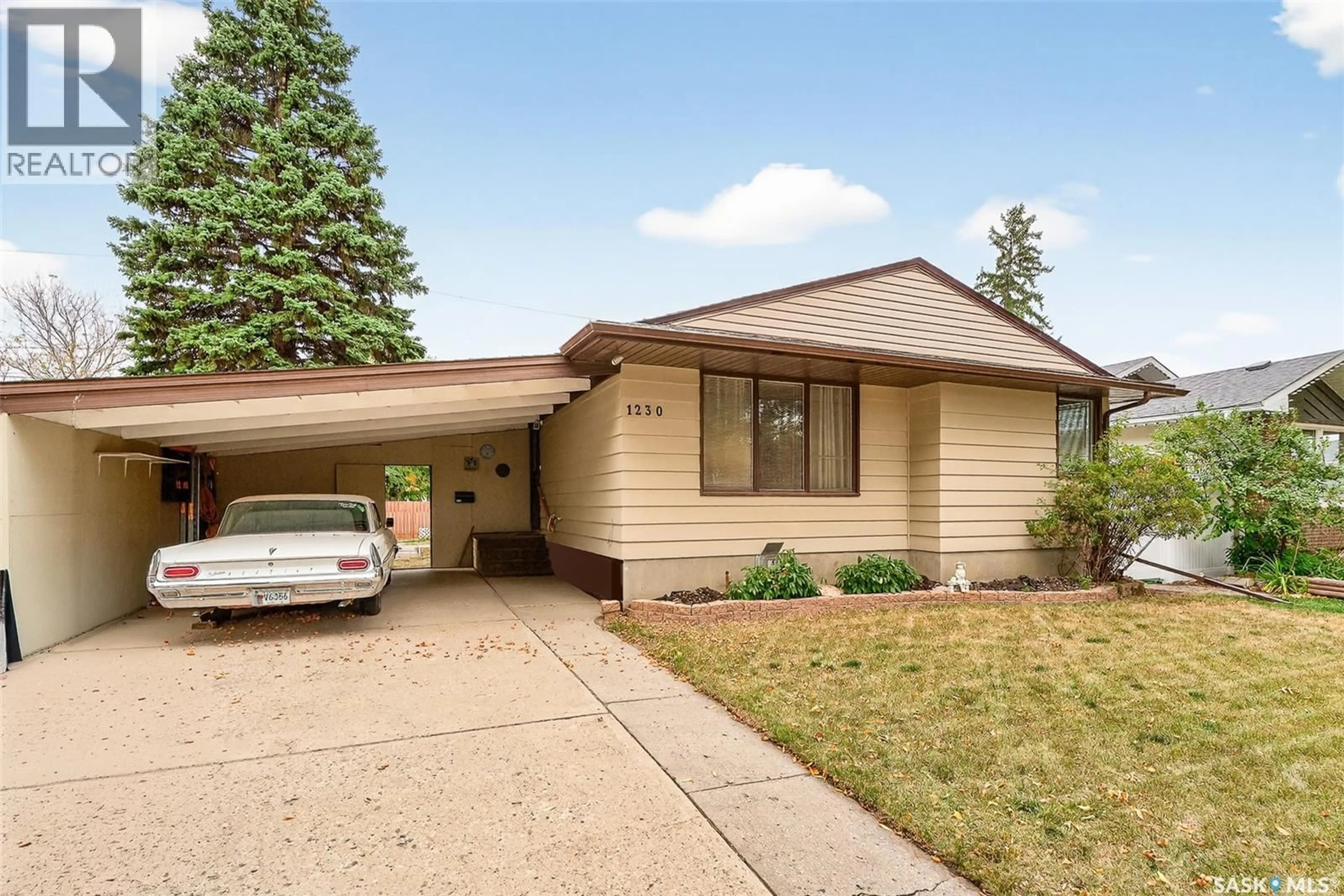 Home with vinyl exterior material, street for 1230 GRACE STREET, Moose Jaw Saskatchewan S6H3C7