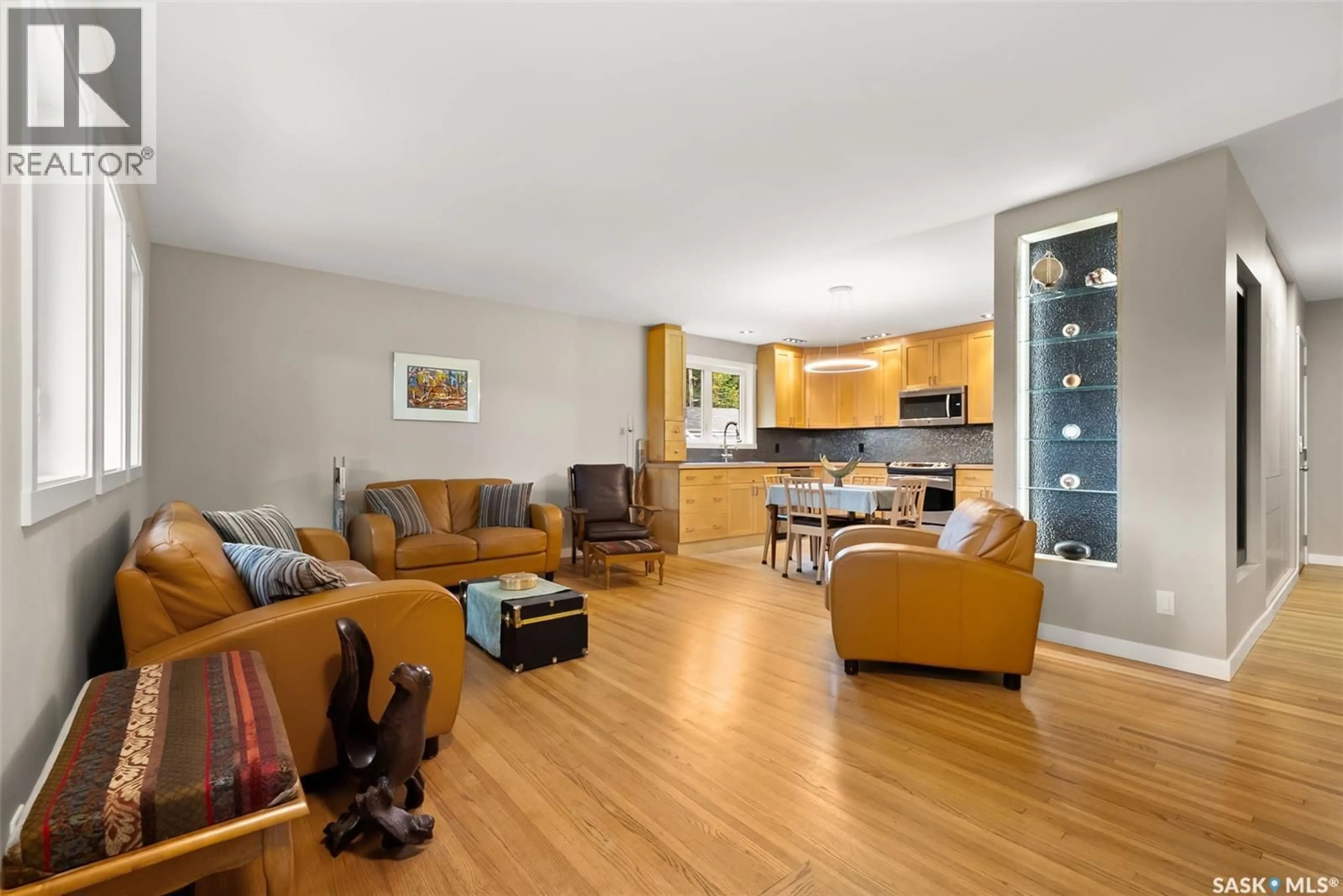 Living room with furniture, wood/laminate floor for 118 LANGLEY STREET, Regina Saskatchewan S4S3V8