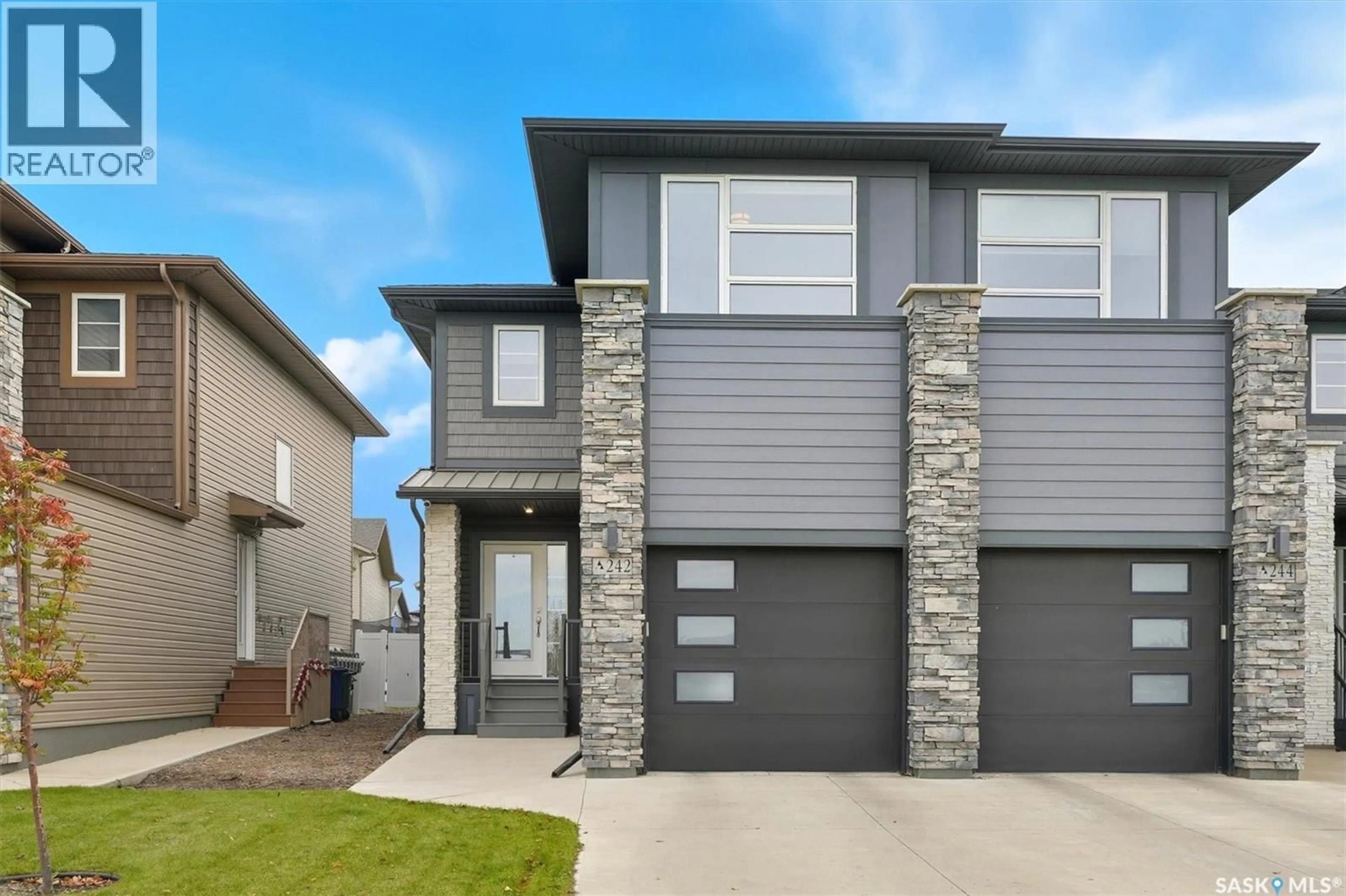 Home with vinyl exterior material, street for 242 BRIGHTON GATE, Saskatoon Saskatchewan S7V0R1
