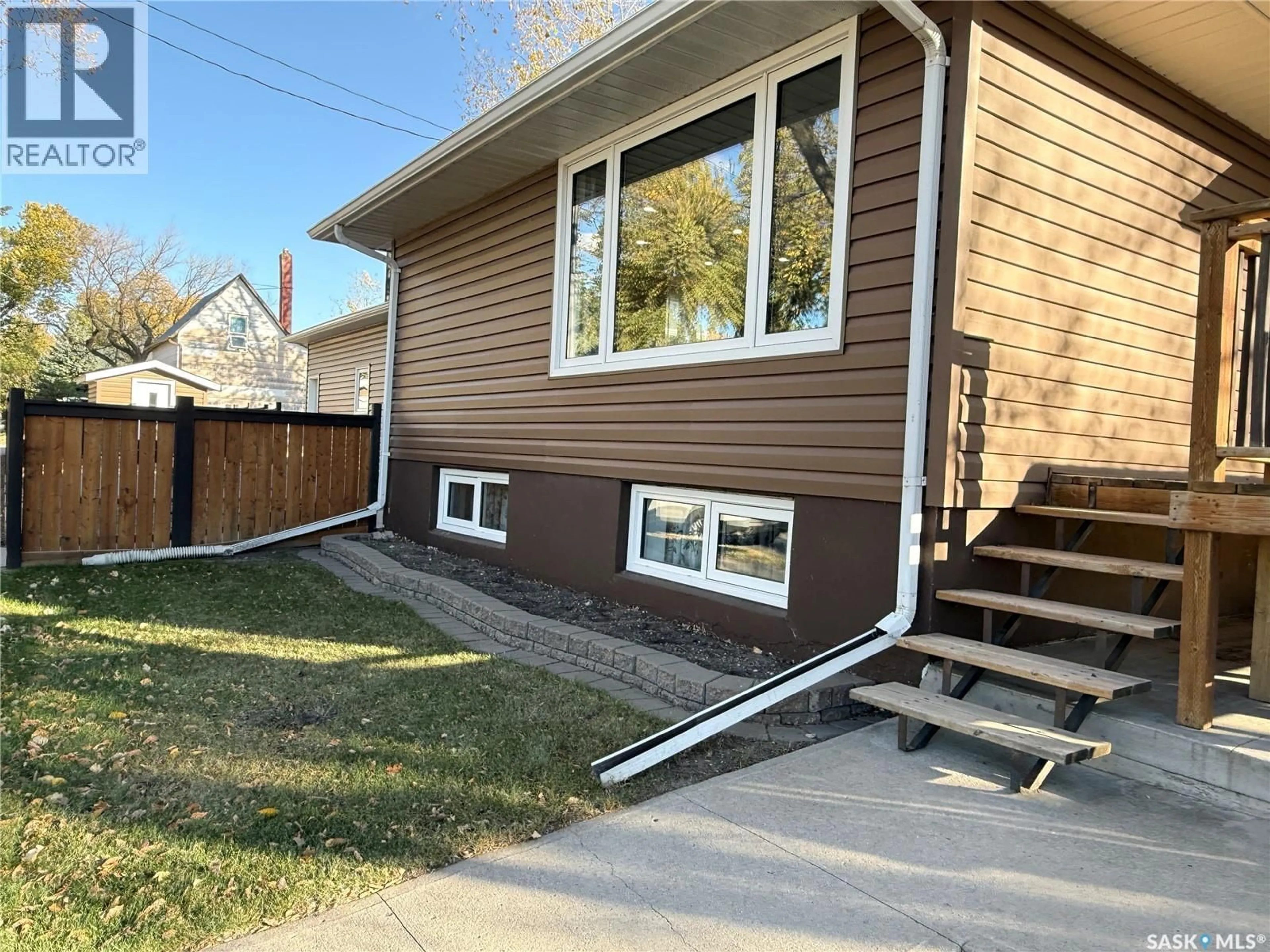 Home with vinyl exterior material, street for 304 GOVERNMENT ROAD, Weyburn Saskatchewan S4H2A8