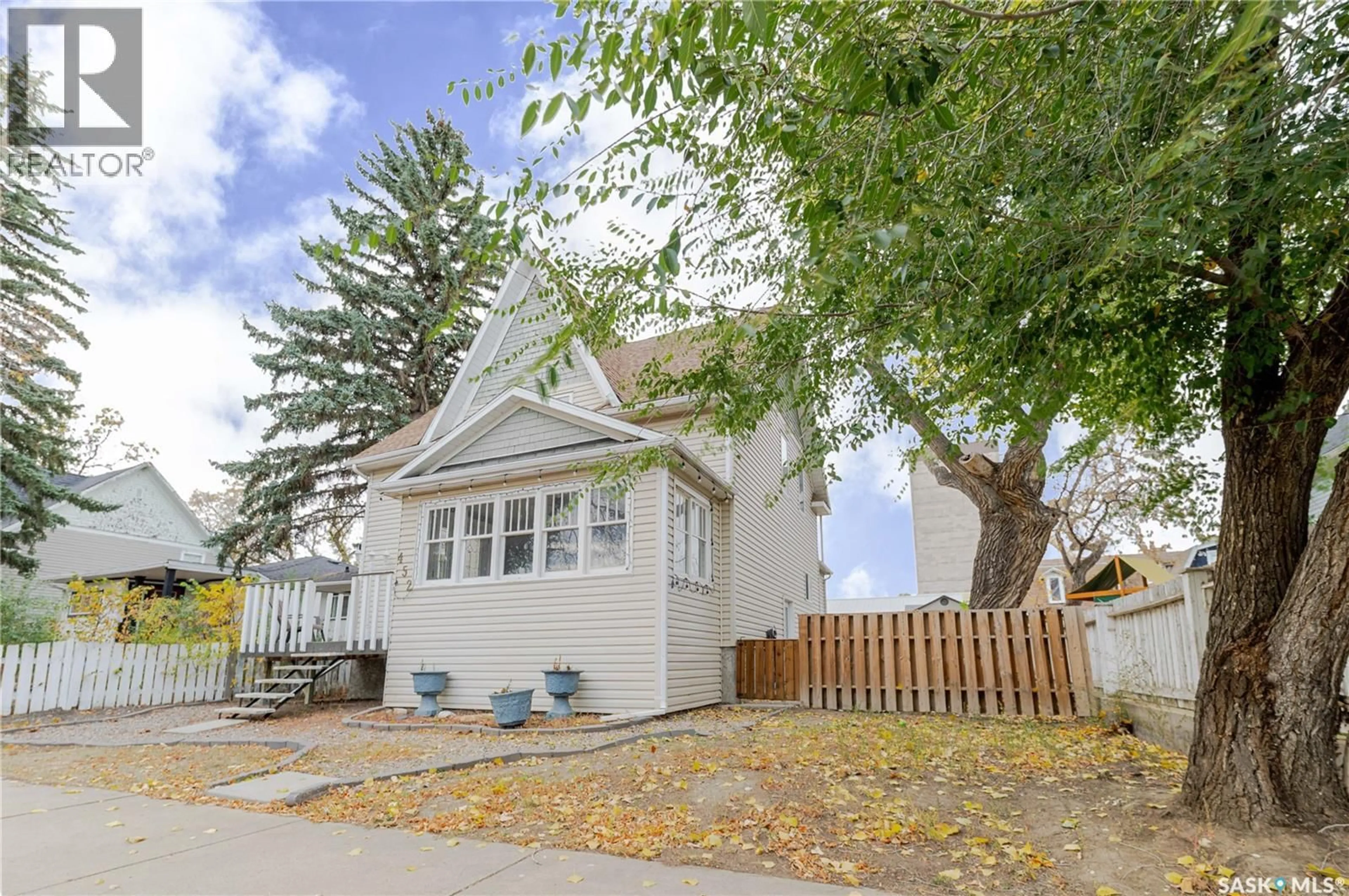 Home with vinyl exterior material, street for E - 452 STADACONA STREET, Moose Jaw Saskatchewan S6H0J8