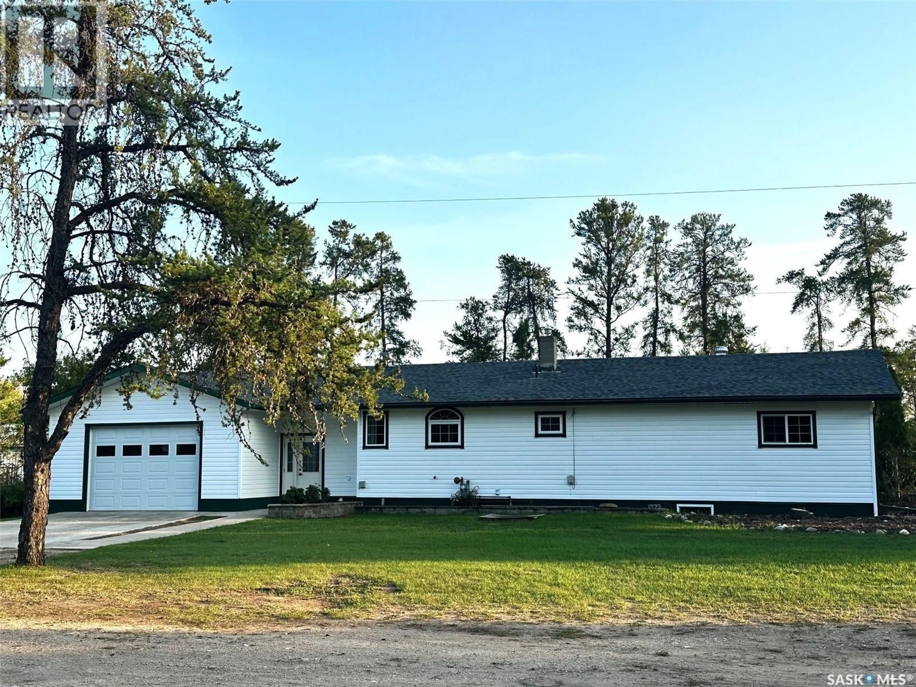 Home with vinyl exterior material, street for ACREAGE, Hudson Bay Saskatchewan S0E0Y0