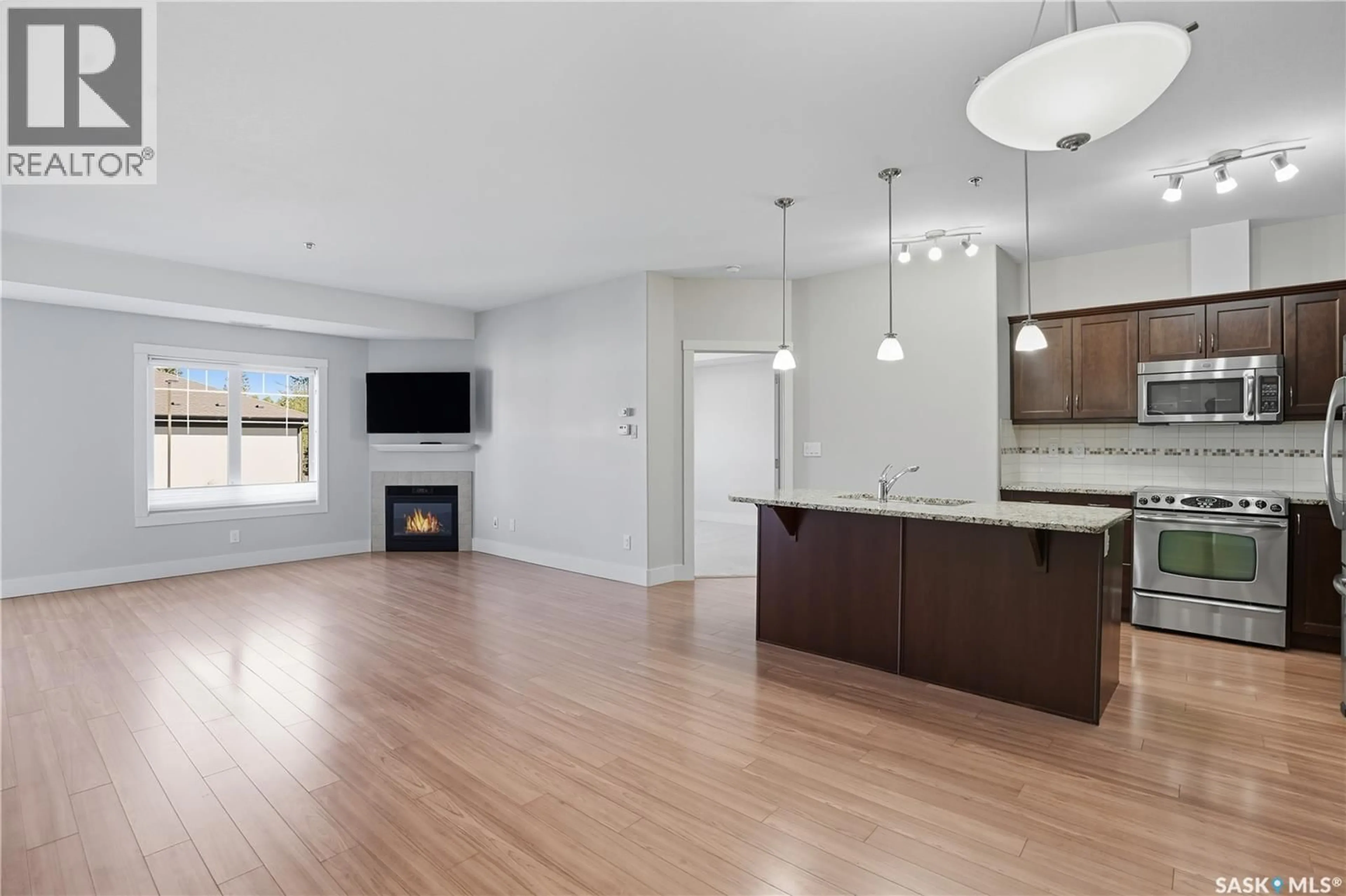 Open concept kitchen, wood/laminate floor for 1010 - 226 RUTH STREET, Saskatoon Saskatchewan S7J4M9