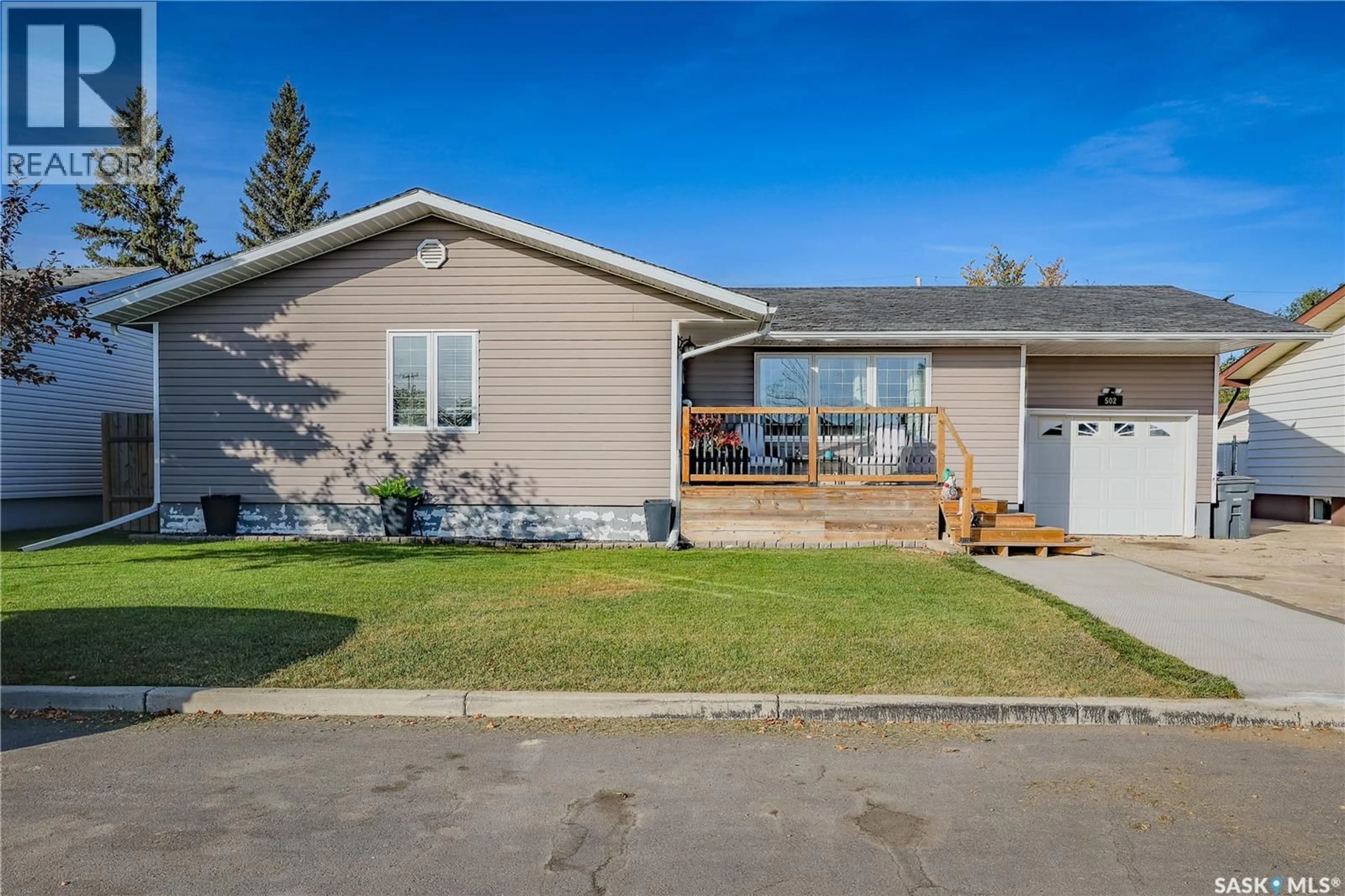 Home with vinyl exterior material, street for 502 MAIN STREET, Delisle Saskatchewan S0L0P0