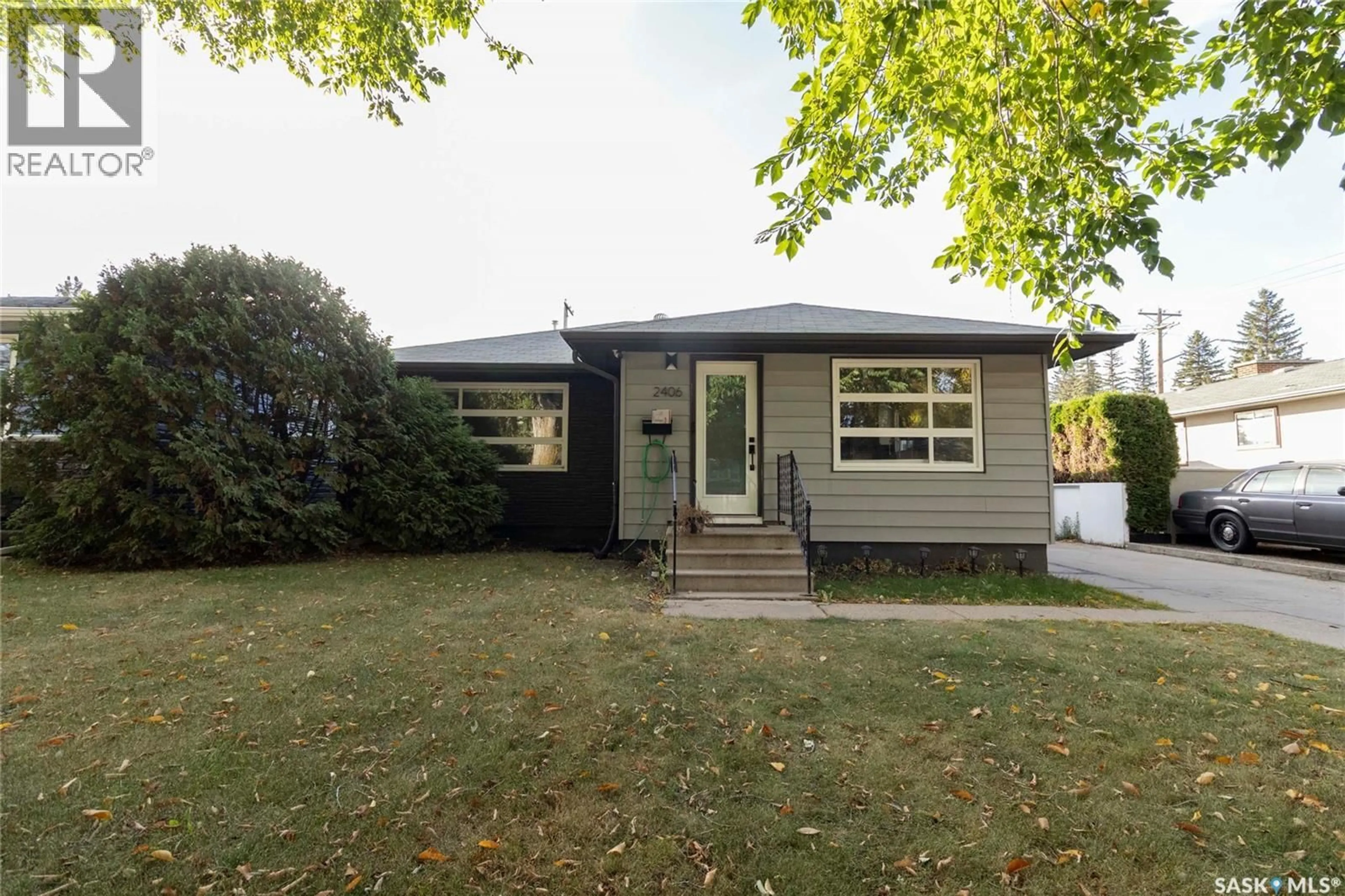 Home with vinyl exterior material, street for 2406 CAIRNS AVENUE, Saskatoon Saskatchewan S7J1V3