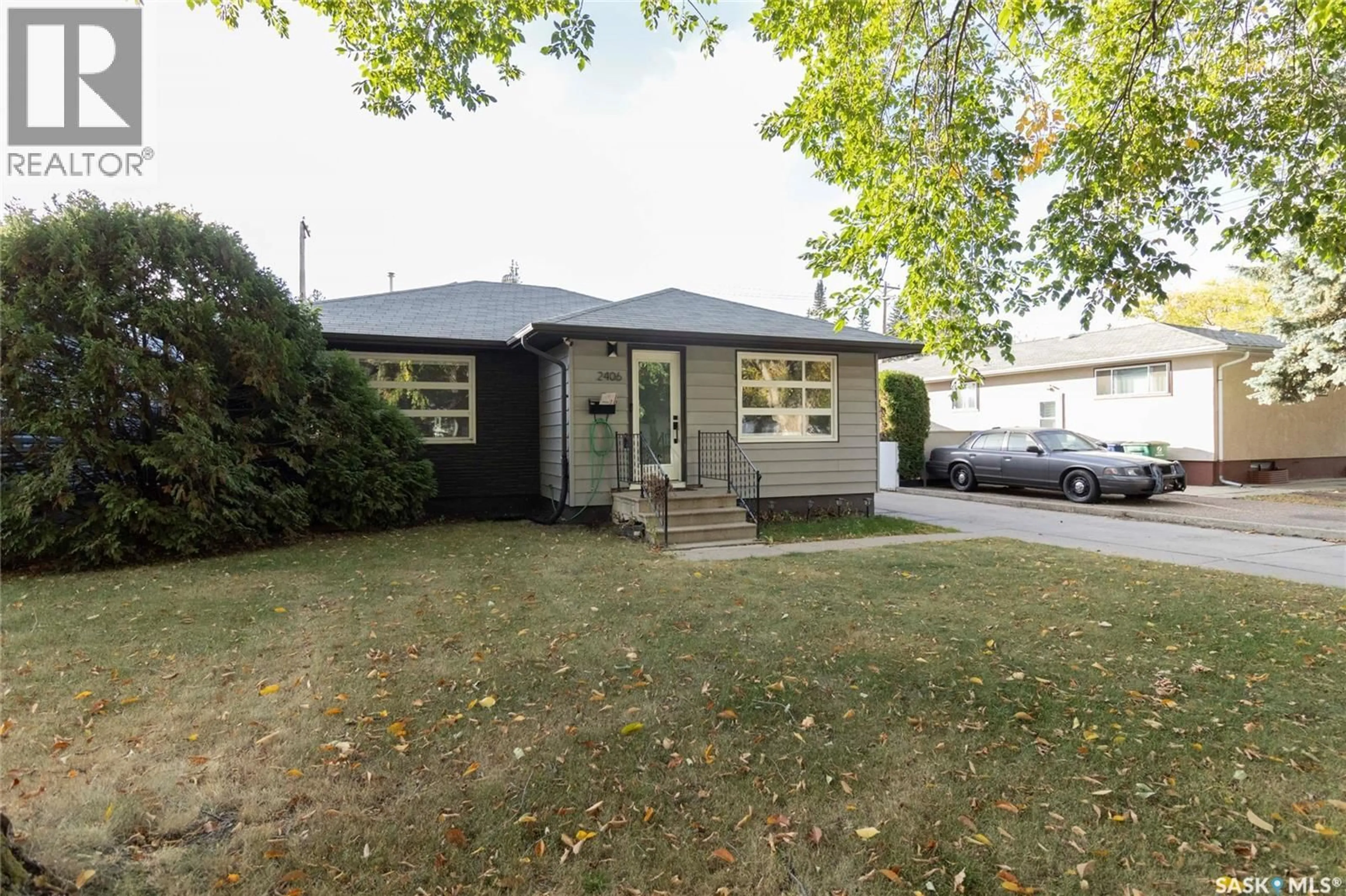Home with vinyl exterior material, street for 2406 CAIRNS AVENUE, Saskatoon Saskatchewan S7J1V3