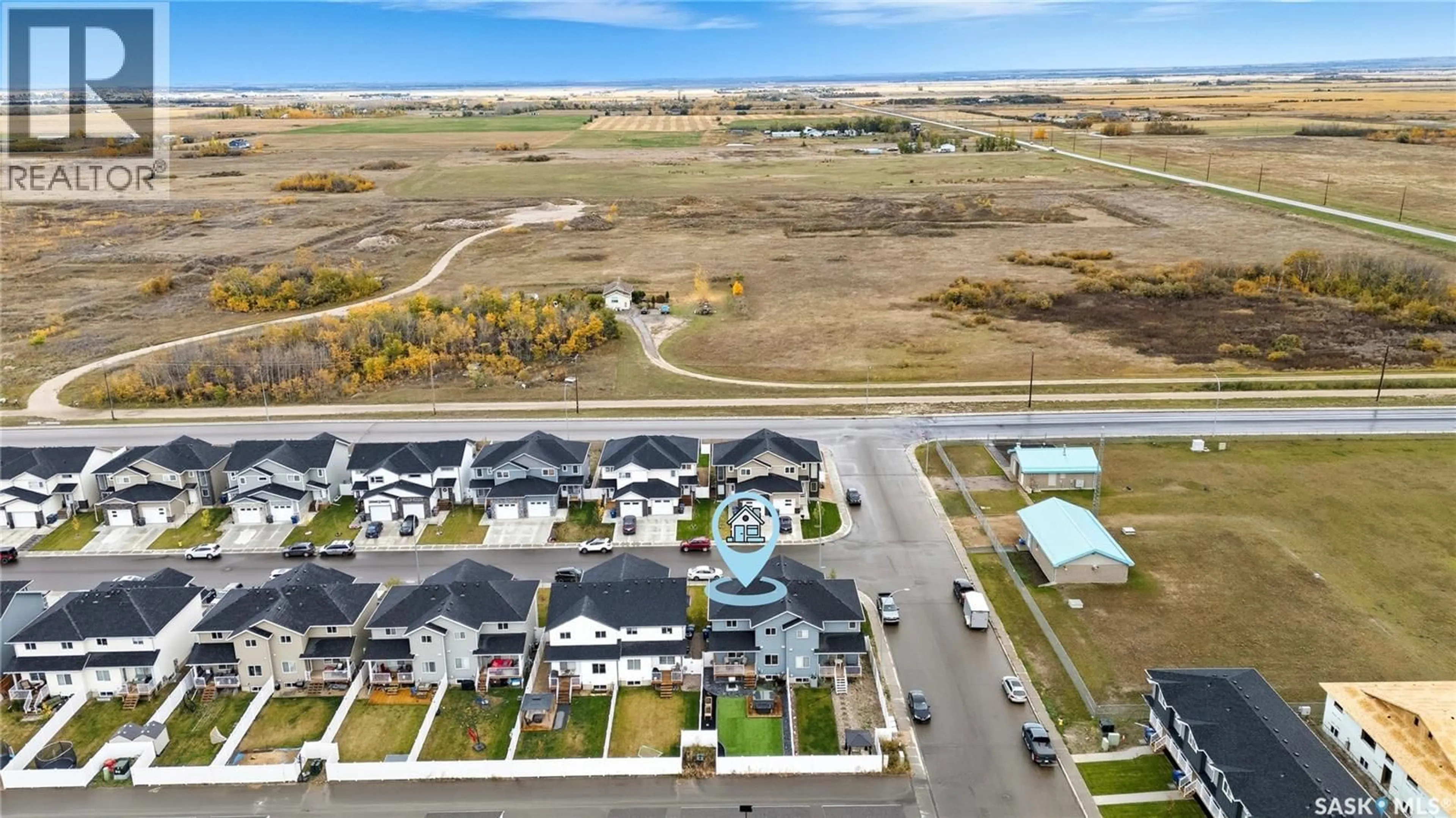 A pic from outside/outdoor area/front of a property/back of a property/a pic from drone, water/lake/river/ocean view for 104 ECHO LANE, Martensville Saskatchewan S0K2T1
