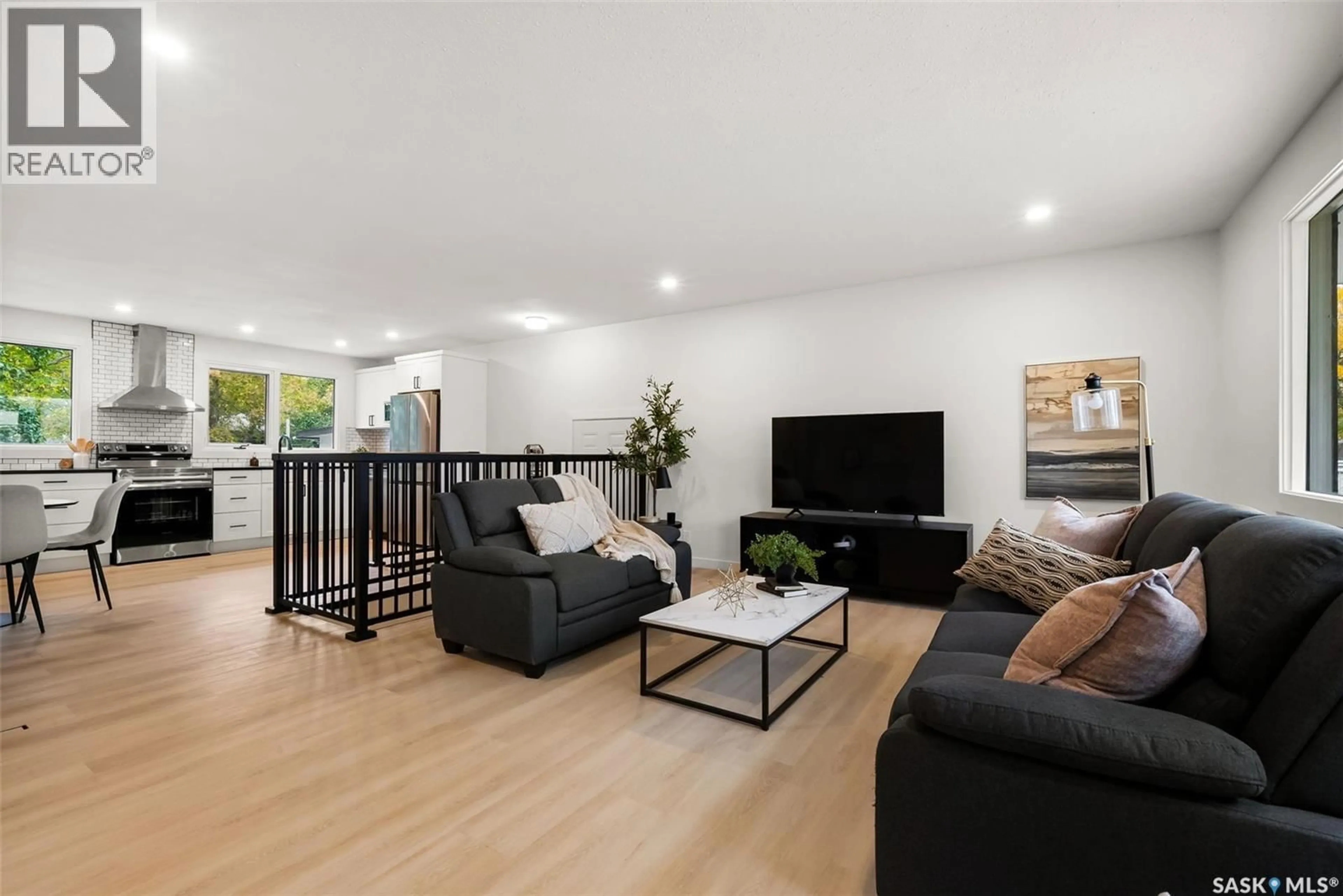 Living room with furniture, wood/laminate floor for 19 ELMVIEW ROAD, Regina Saskatchewan S4R0B1