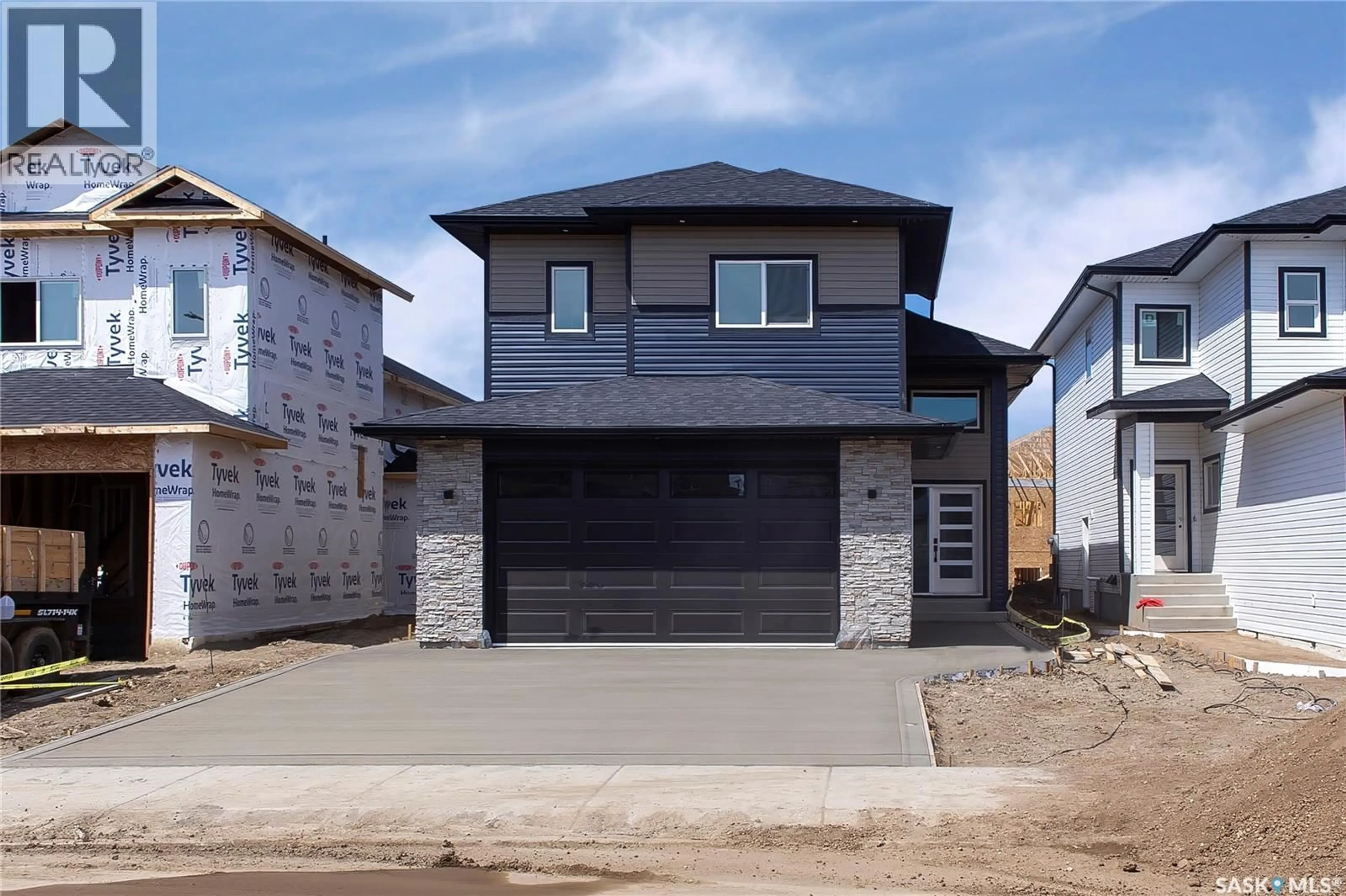 Home with brick exterior material, street for 823 NIGHTINGALE ROAD, Saskatoon Saskatchewan S7L6X7