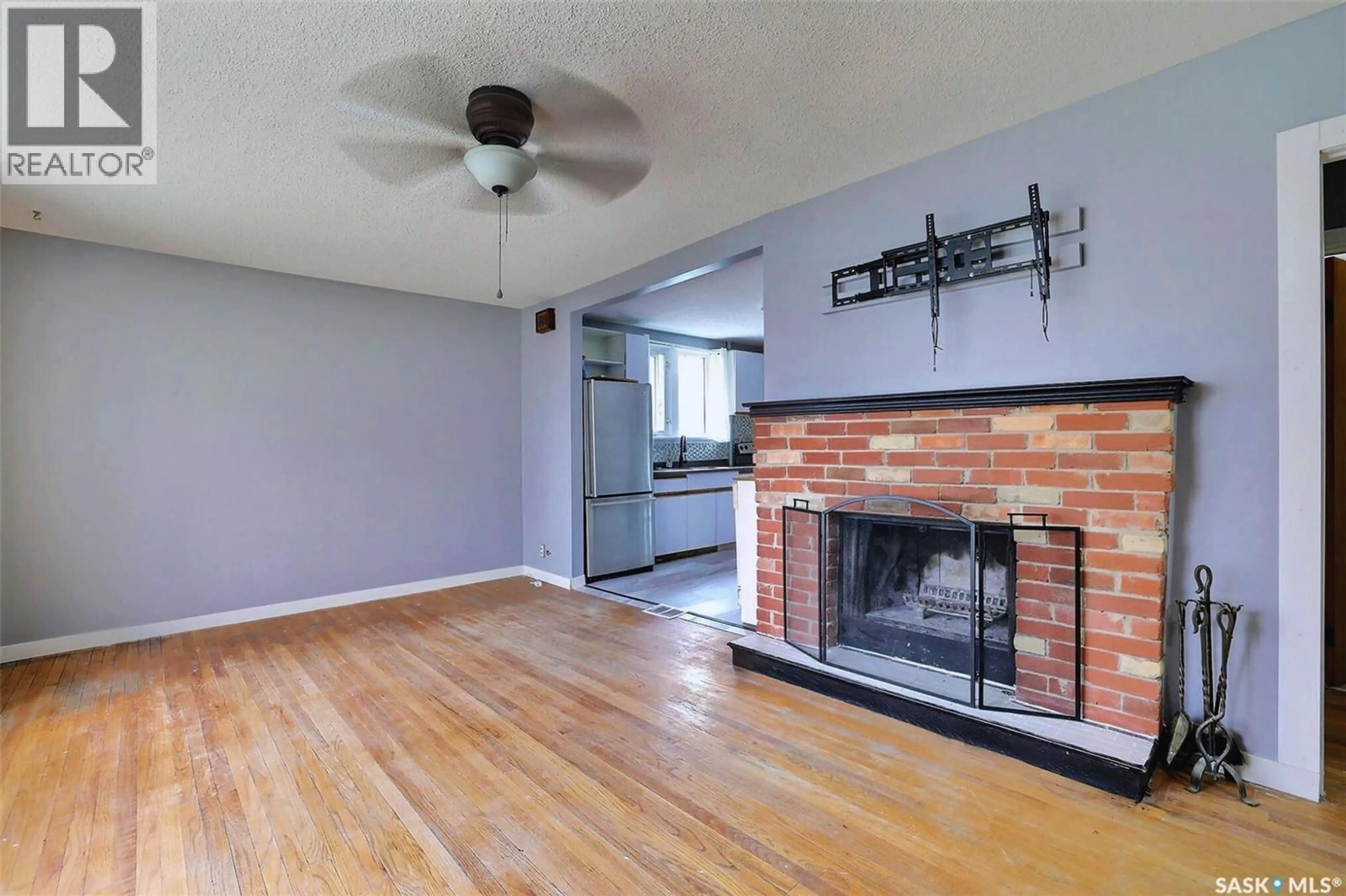 Living room with furniture, wood/laminate floor for 840 ARGYLE STREET, Regina Saskatchewan S4T3P8