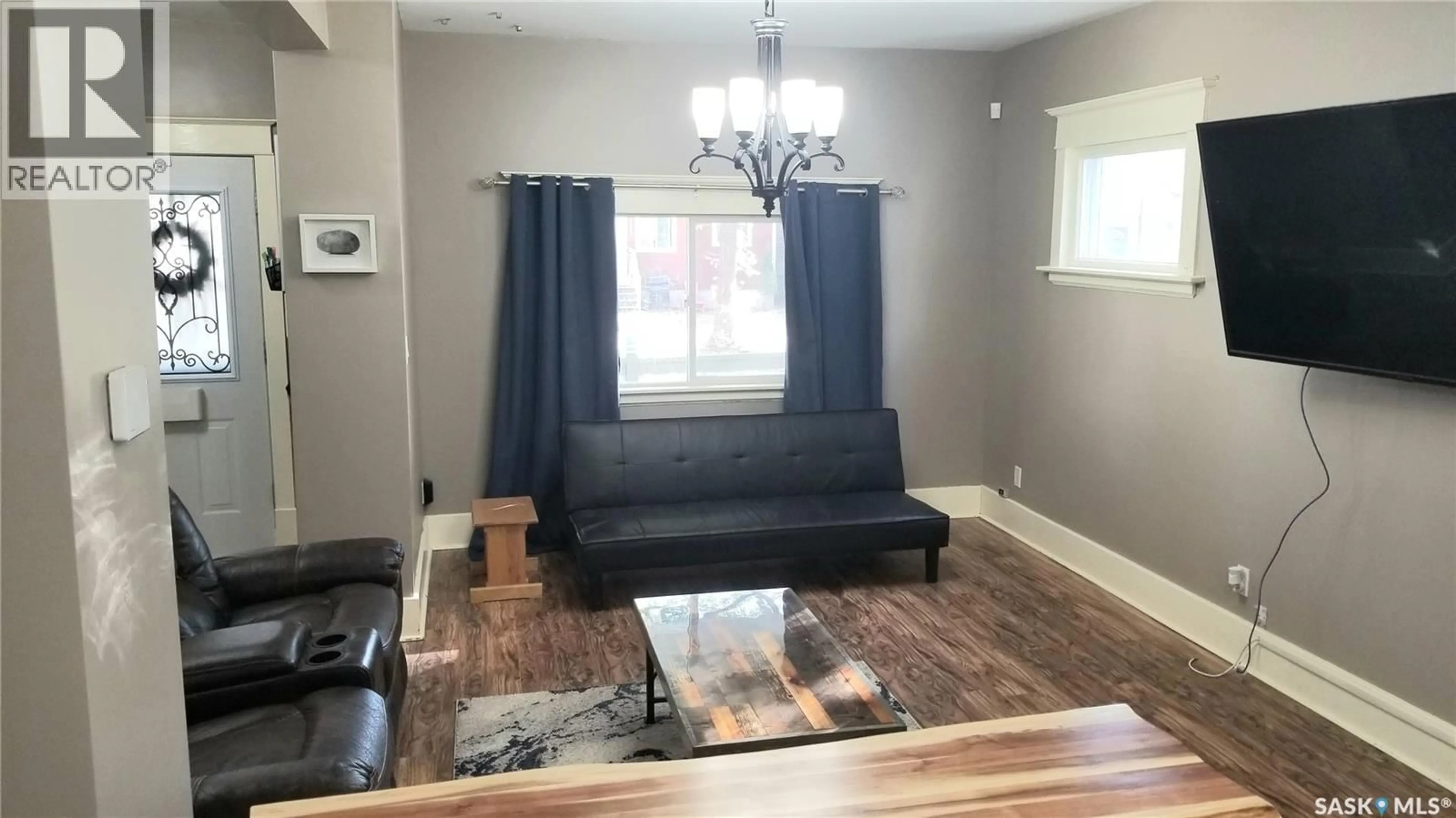 Living room with furniture, wood/laminate floor for 1422 CAMERON STREET, Regina Saskatchewan S4T2T4