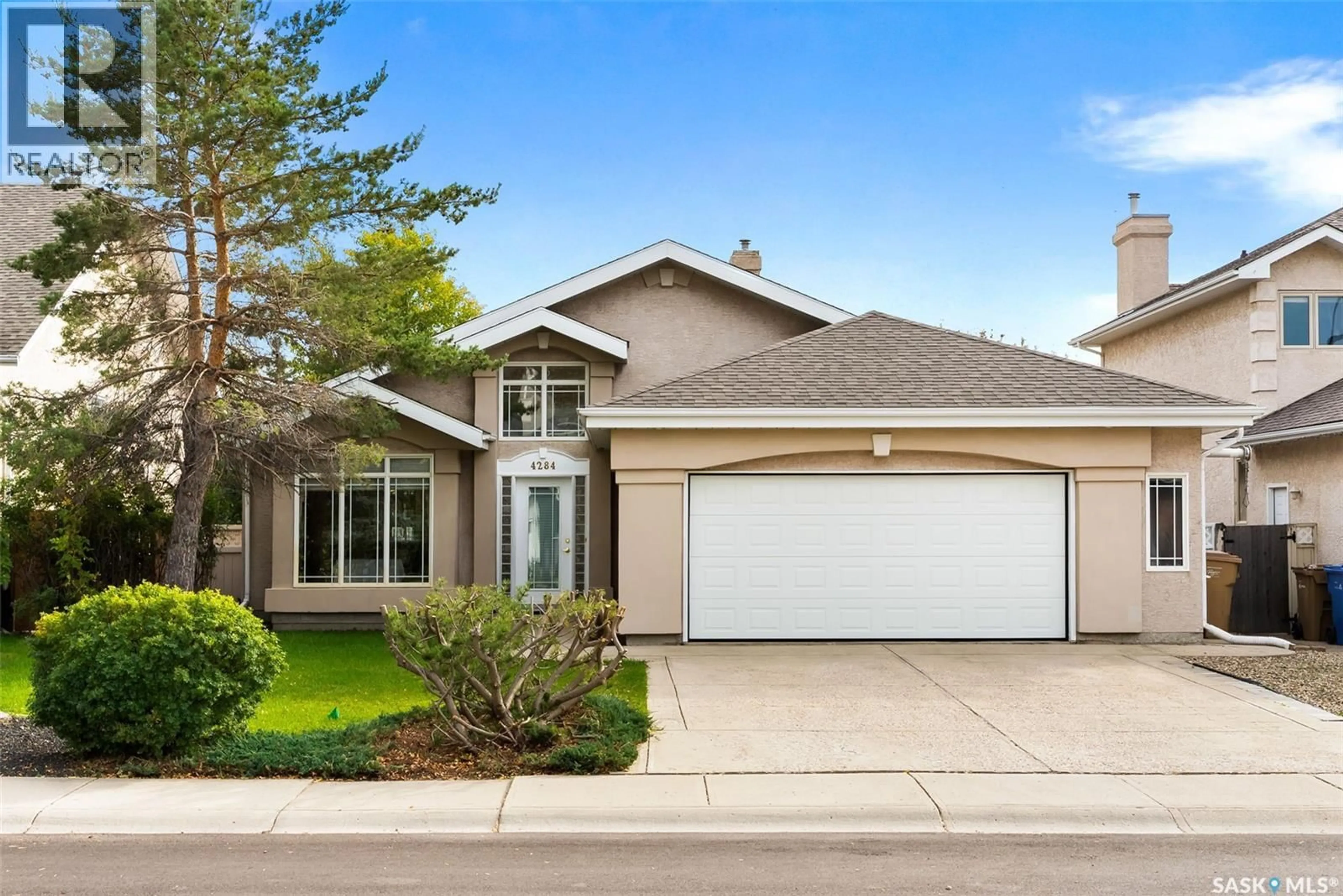Home with vinyl exterior material, street for 4284 WASCANA RIDGE, Regina Saskatchewan S4V2T3