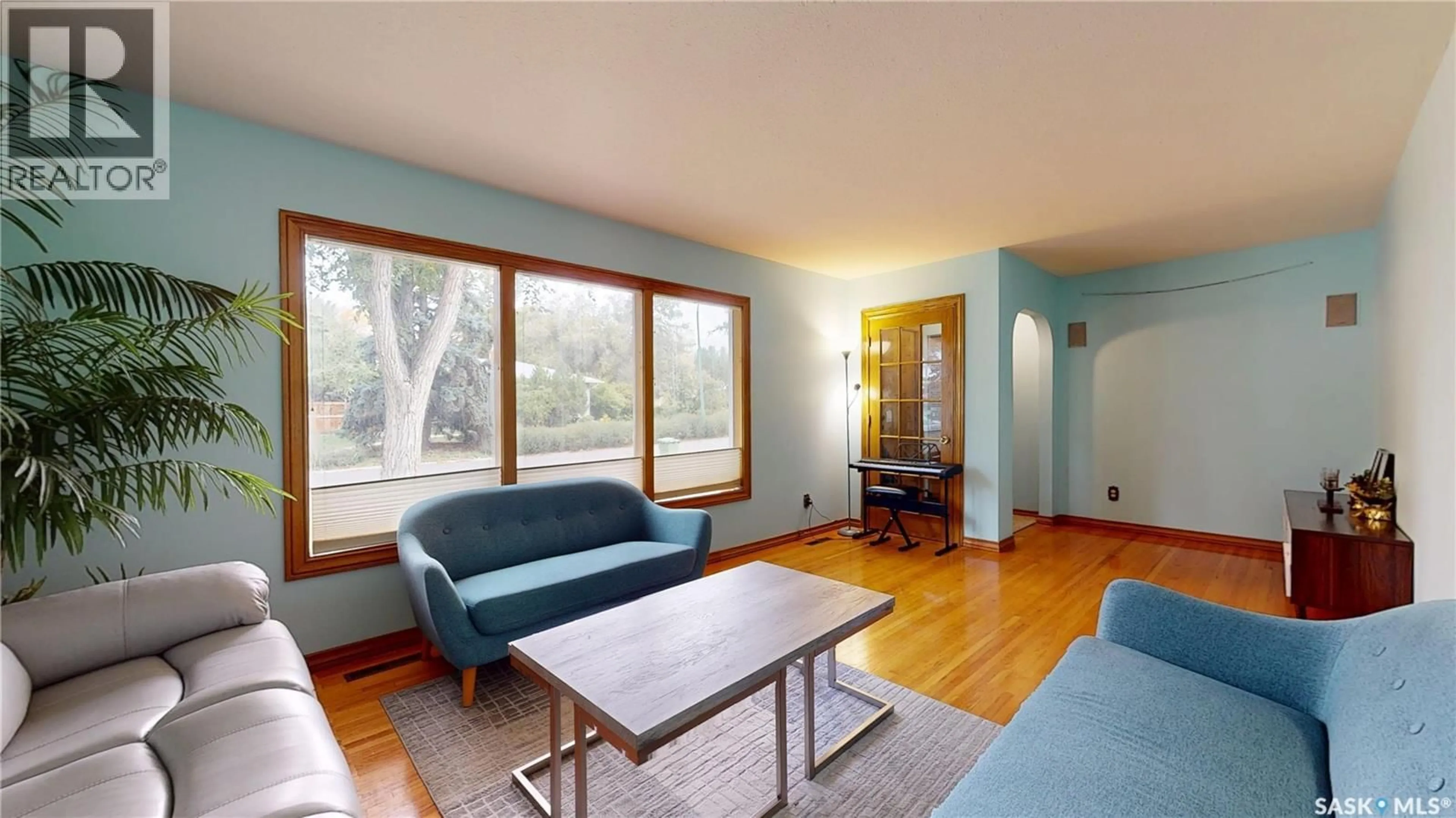 Living room with furniture, wood/laminate floor for 43 HAWTHORNE CRESCENT, Regina Saskatchewan S4S4Y1