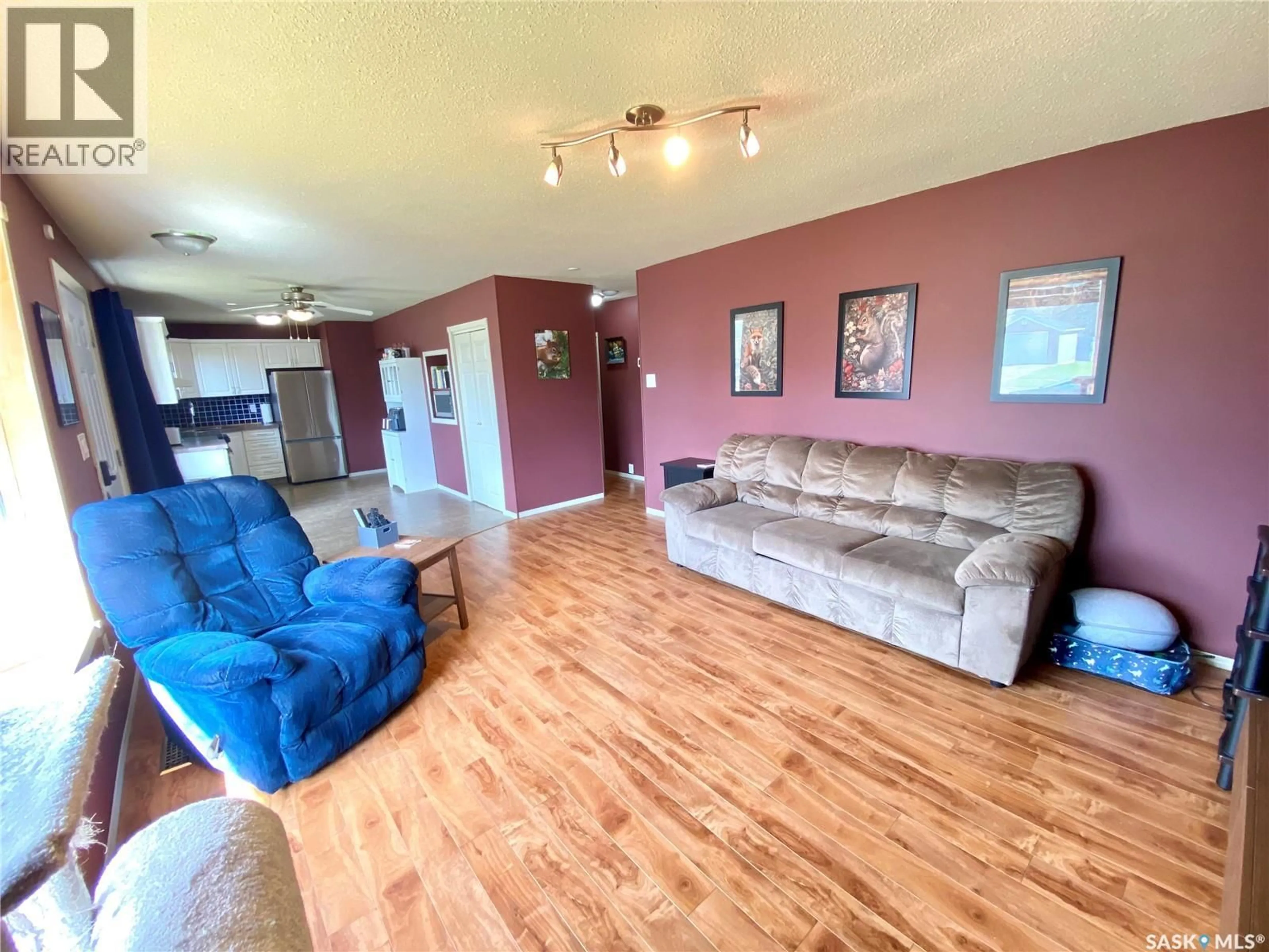 Living room with furniture, wood/laminate floor for 425 YOUNG STREET, Bienfait Saskatchewan S0C0M0