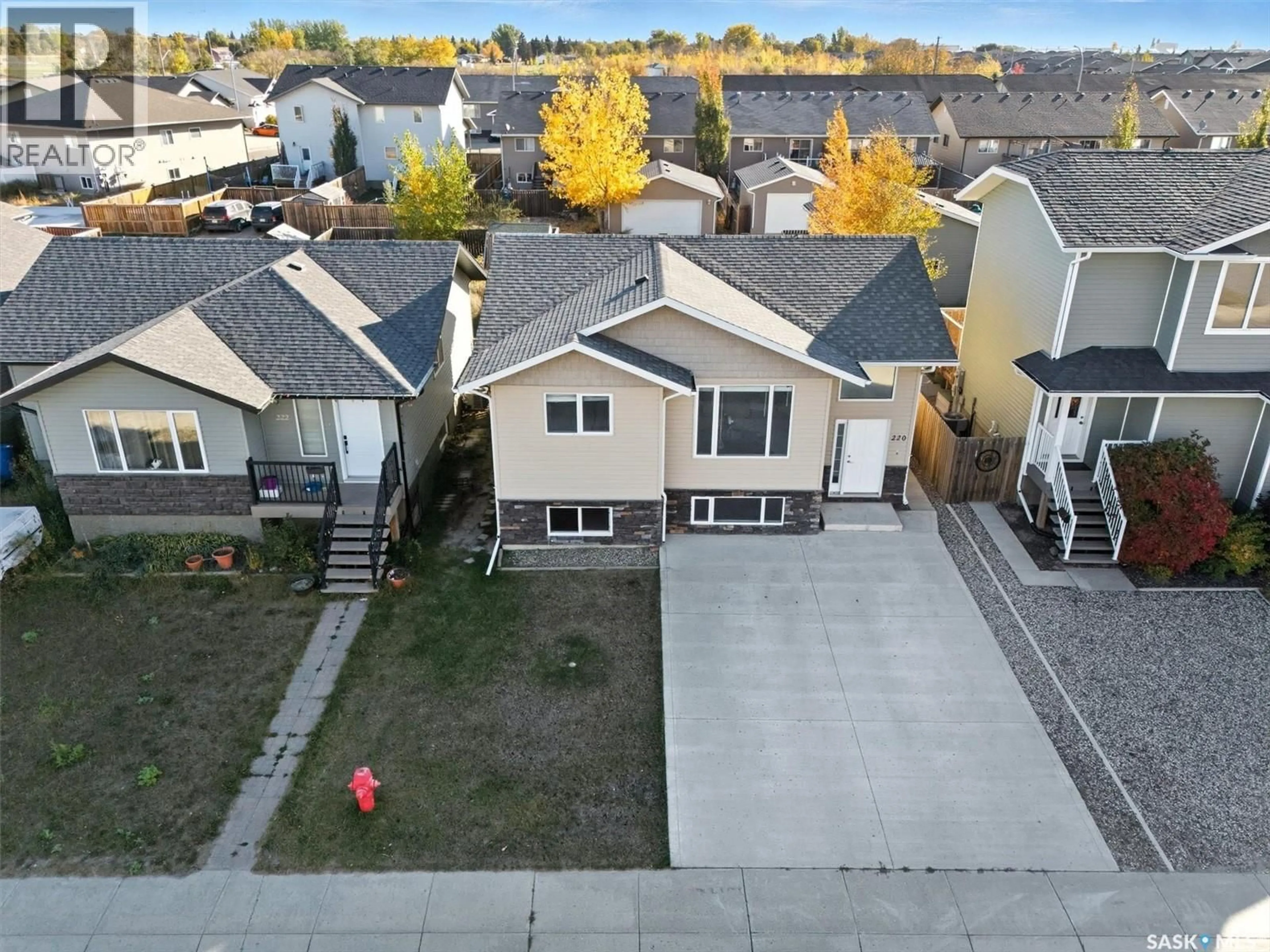 A pic from outside/outdoor area/front of a property/back of a property/a pic from drone, street for 220 WARWICK CRESCENT, Warman Saskatchewan S0K4S0