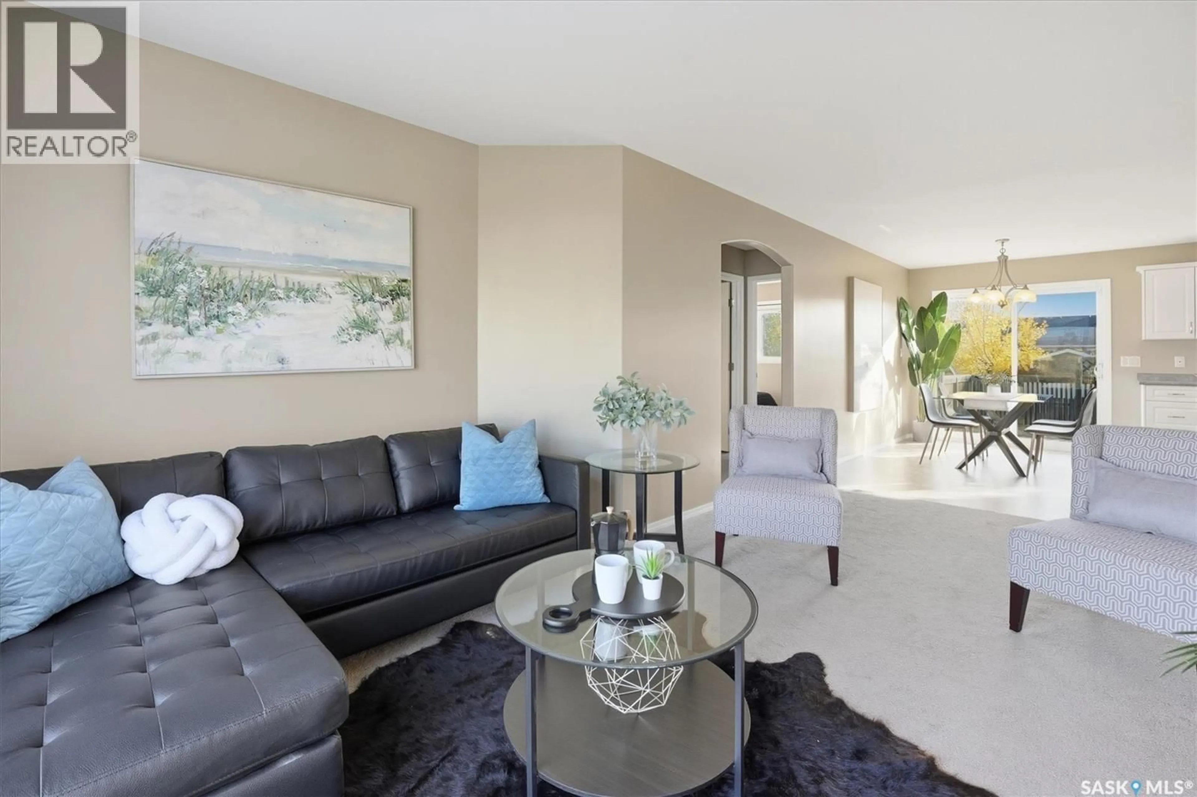 Living room with furniture, unknown for 220 WARWICK CRESCENT, Warman Saskatchewan S0K4S0