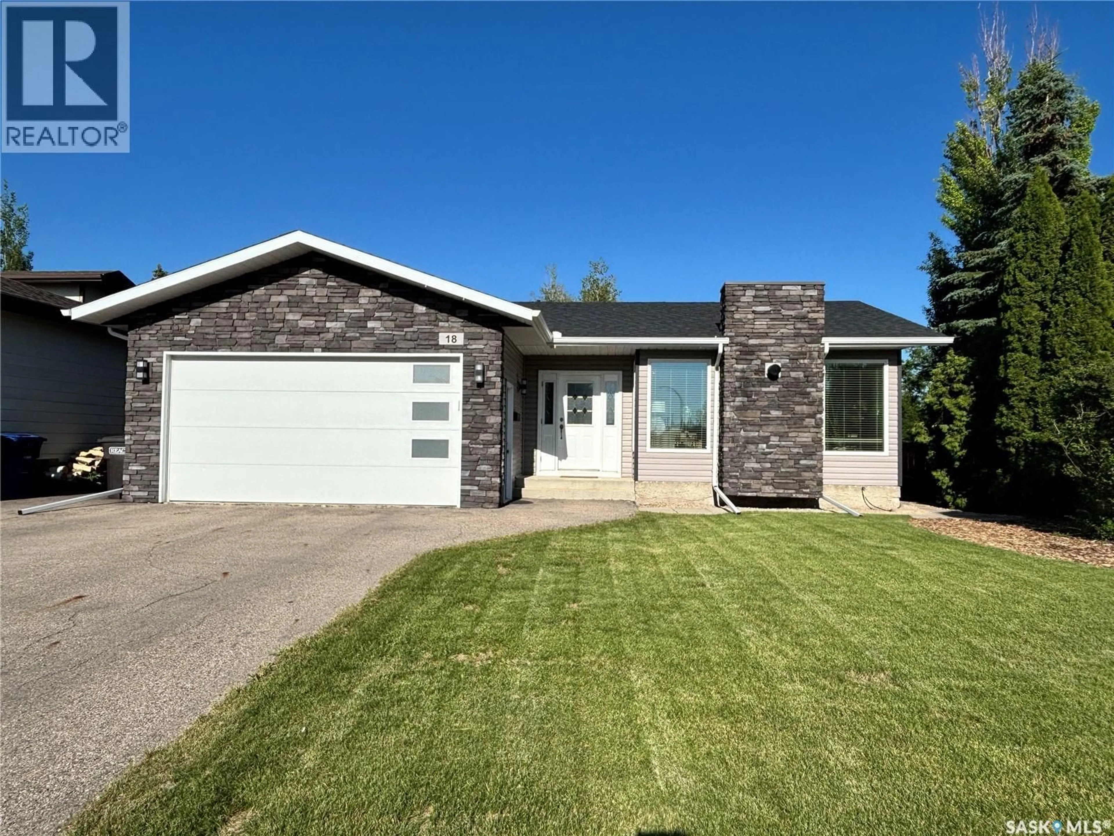 Home with vinyl exterior material, street for 18 DUST CRESCENT, Humboldt Saskatchewan S0K2A0
