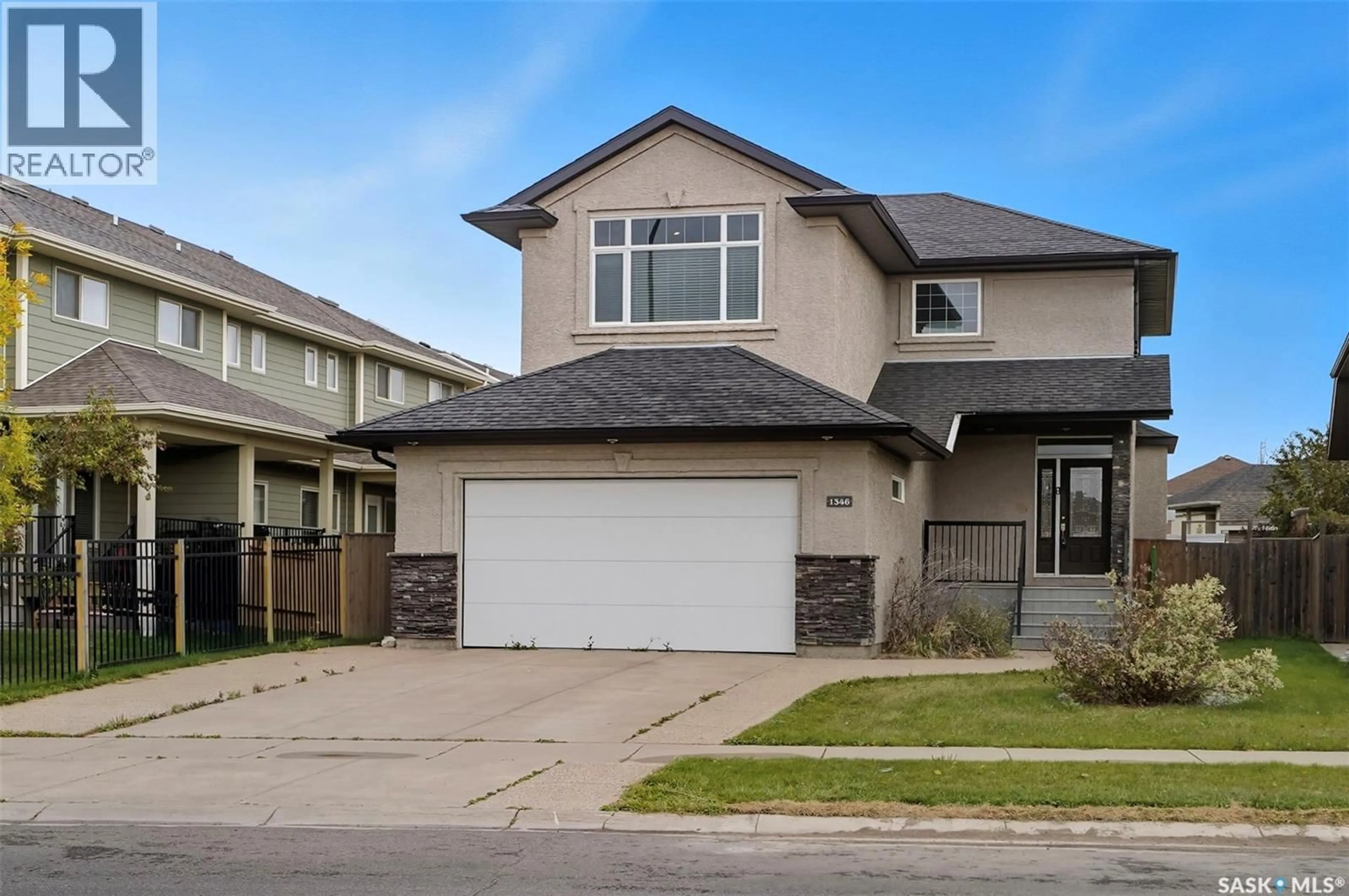 Home with vinyl exterior material, street for 1346 STENSRUD ROAD, Saskatoon Saskatchewan S7W0B9