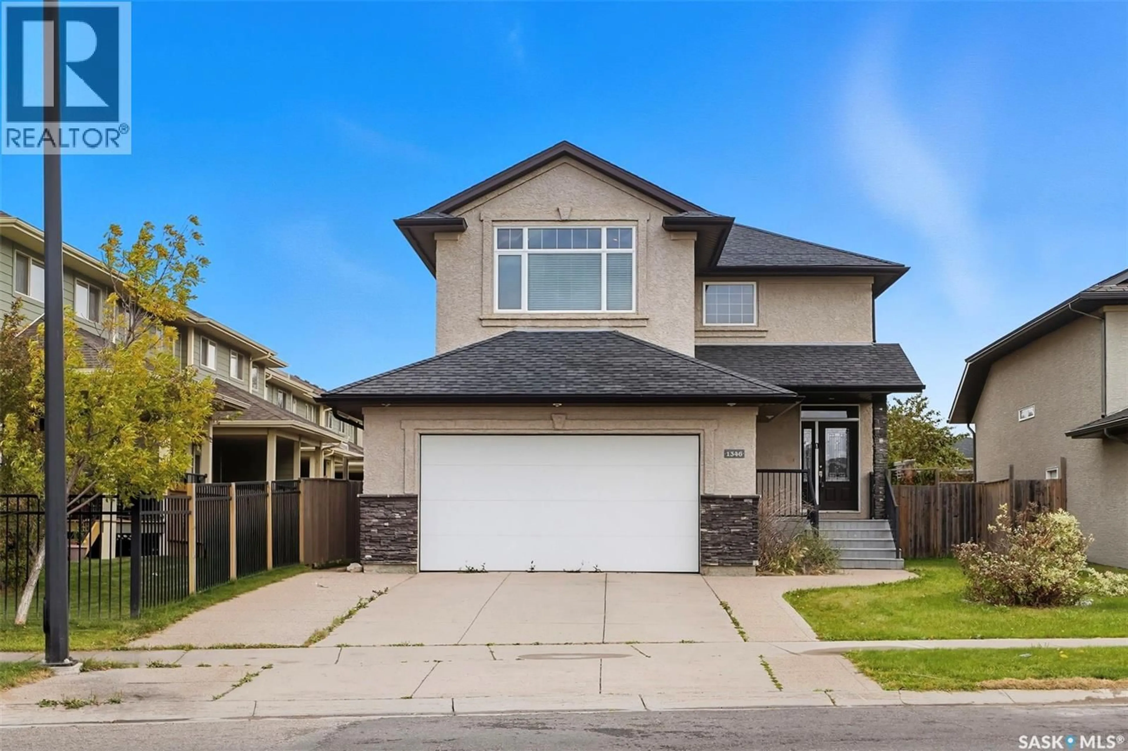Home with vinyl exterior material, street for 1346 STENSRUD ROAD, Saskatoon Saskatchewan S7W0B9