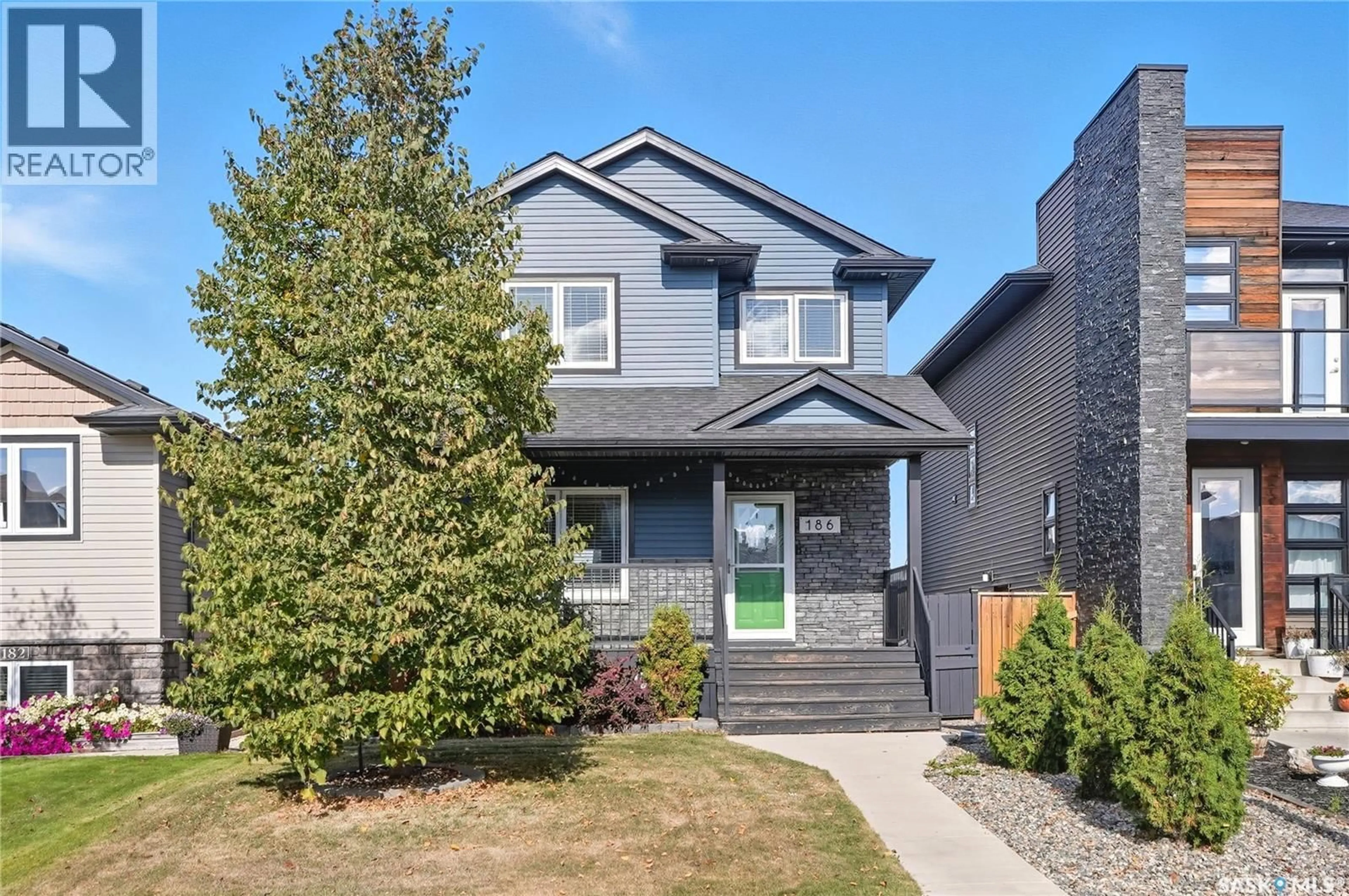 Home with vinyl exterior material, street for 186 RAJPUT WAY, Saskatoon Saskatchewan S7W0L5