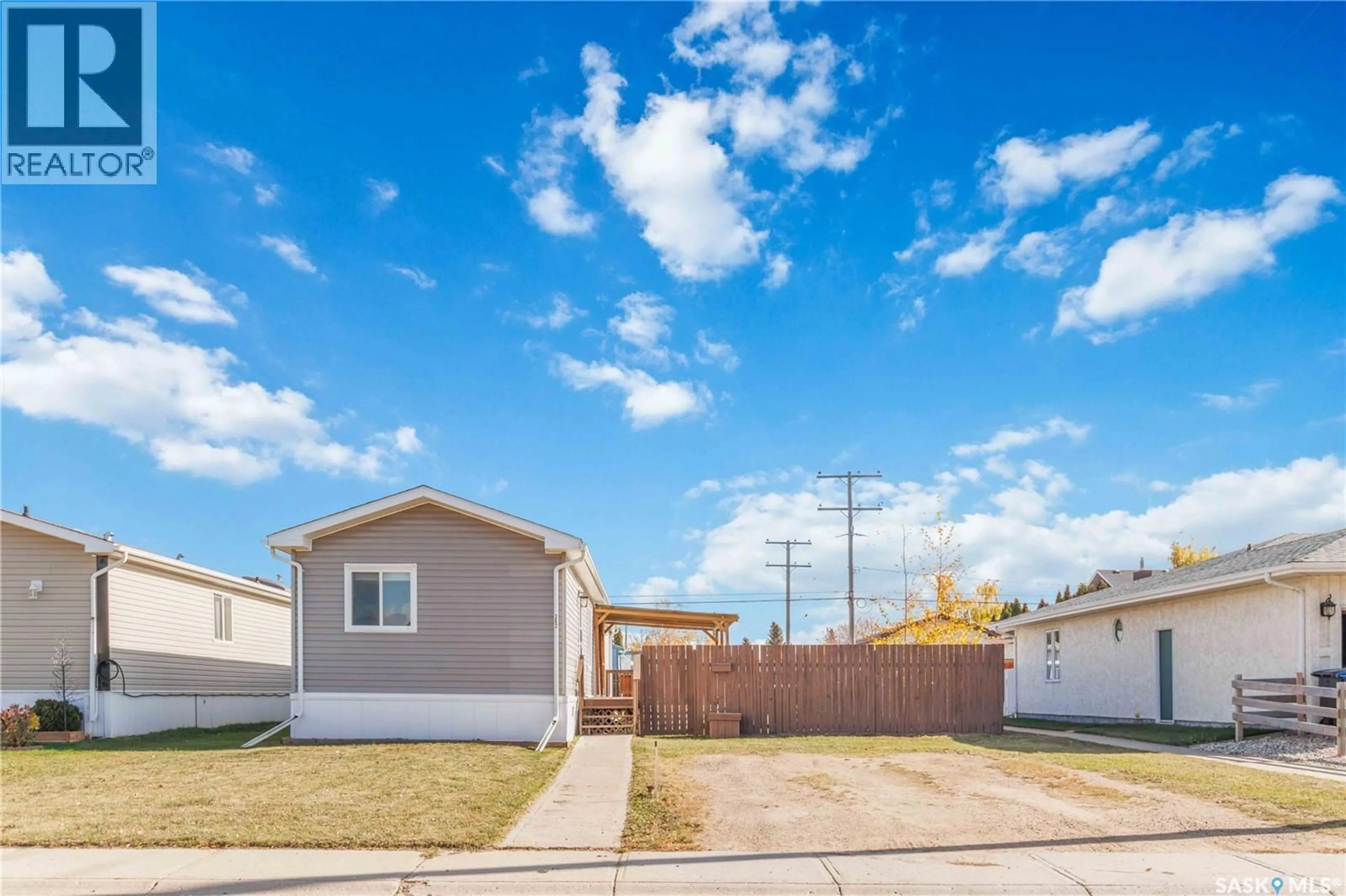 Home with vinyl exterior material, street for 202 14TH STREET, Humboldt Saskatchewan S0K2A0