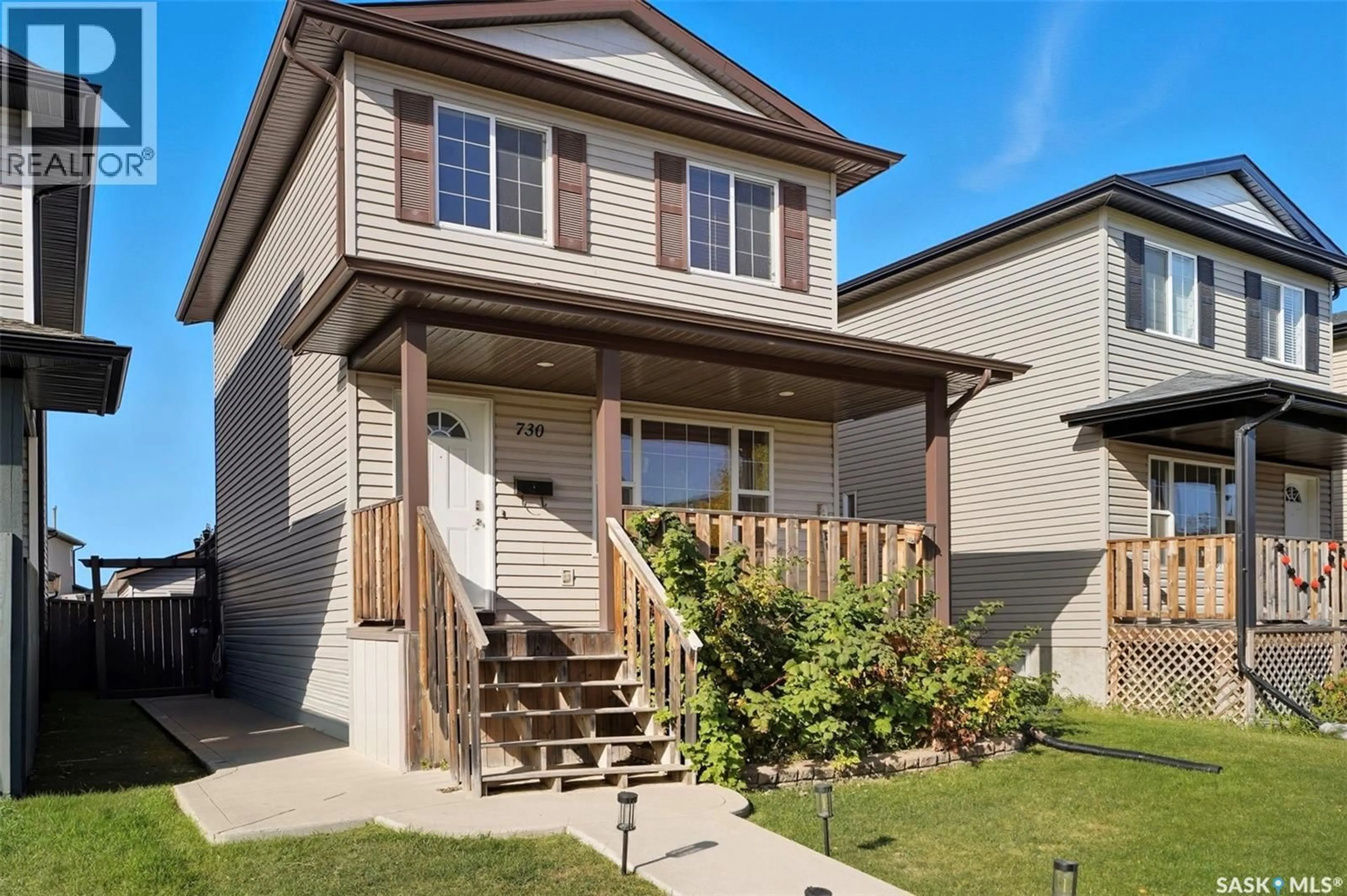 Home with vinyl exterior material, street for 730 LAMARSH LANE, Saskatoon Saskatchewan S7W1B6
