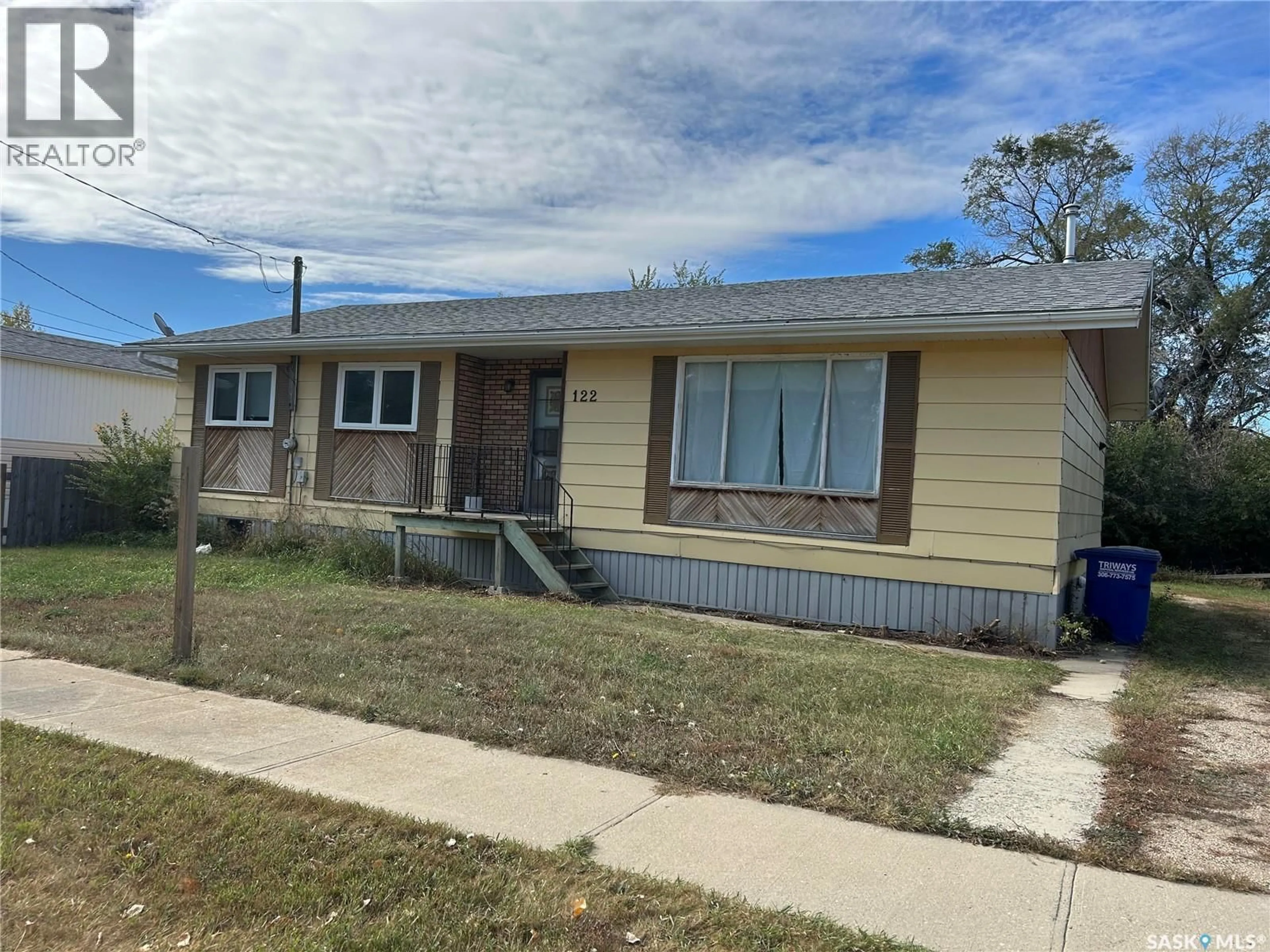 Home with vinyl exterior material, street for 122 1ST STREET, Chaplin Saskatchewan S0H0V0