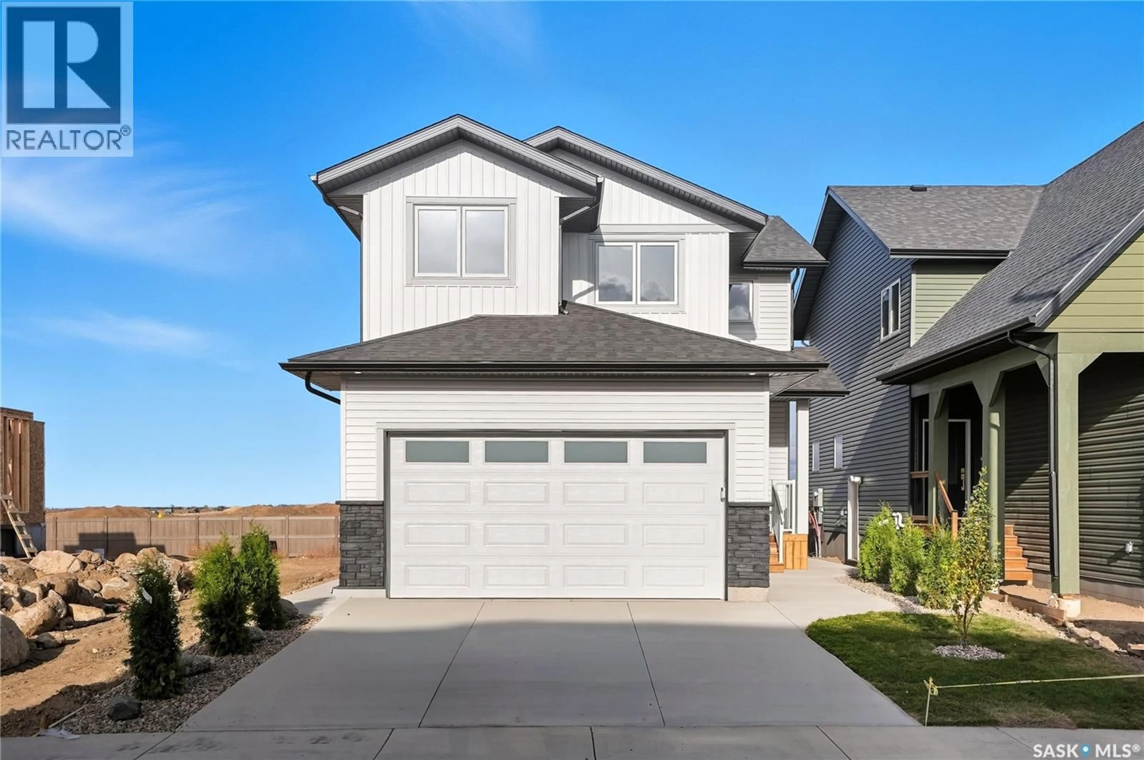 Home with vinyl exterior material, street for 311 SHARMA CRESCENT, Saskatoon Saskatchewan S7W1L1