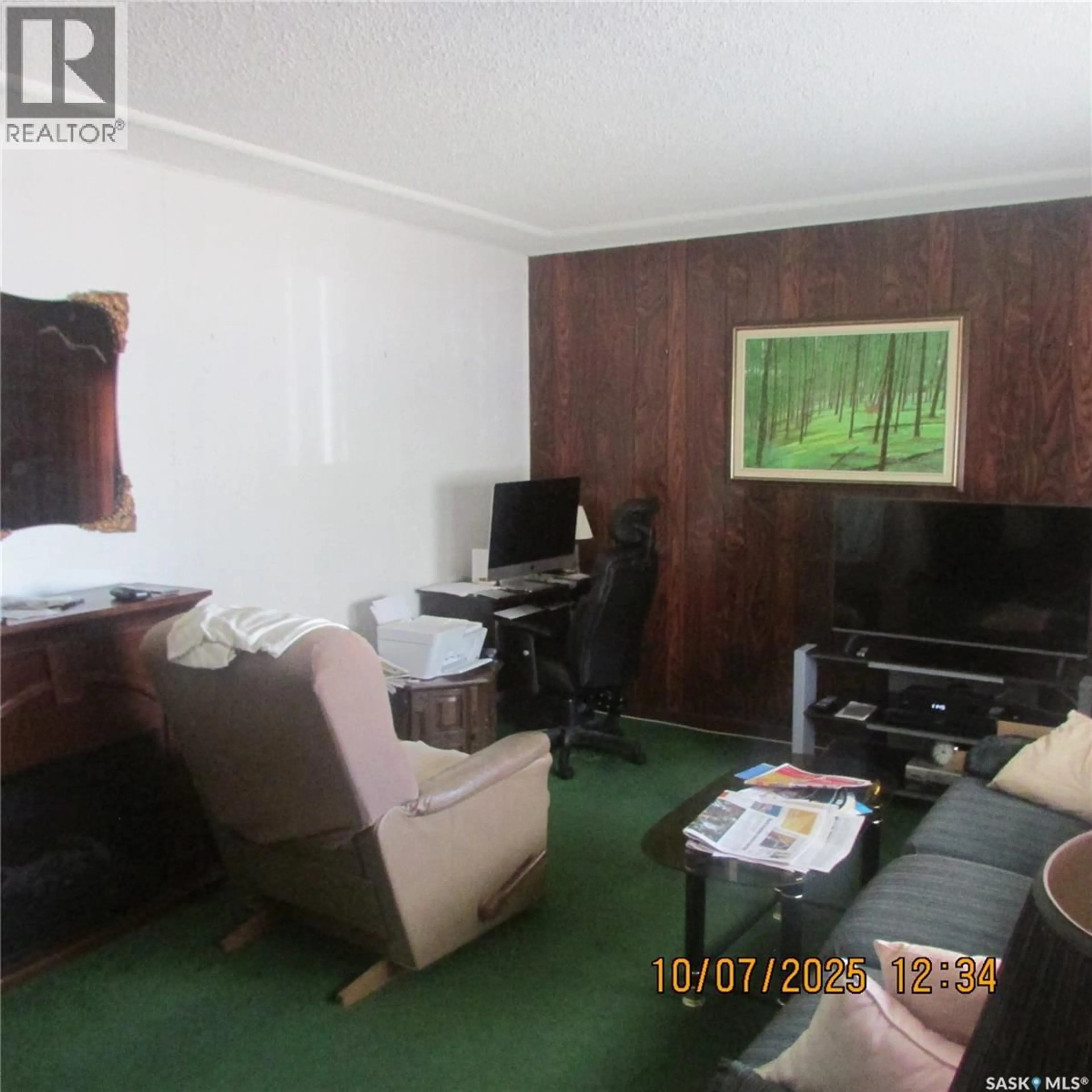 Living room with furniture, wood/laminate floor for 2600 WASCANA STREET, Regina Saskatchewan S4S0L8