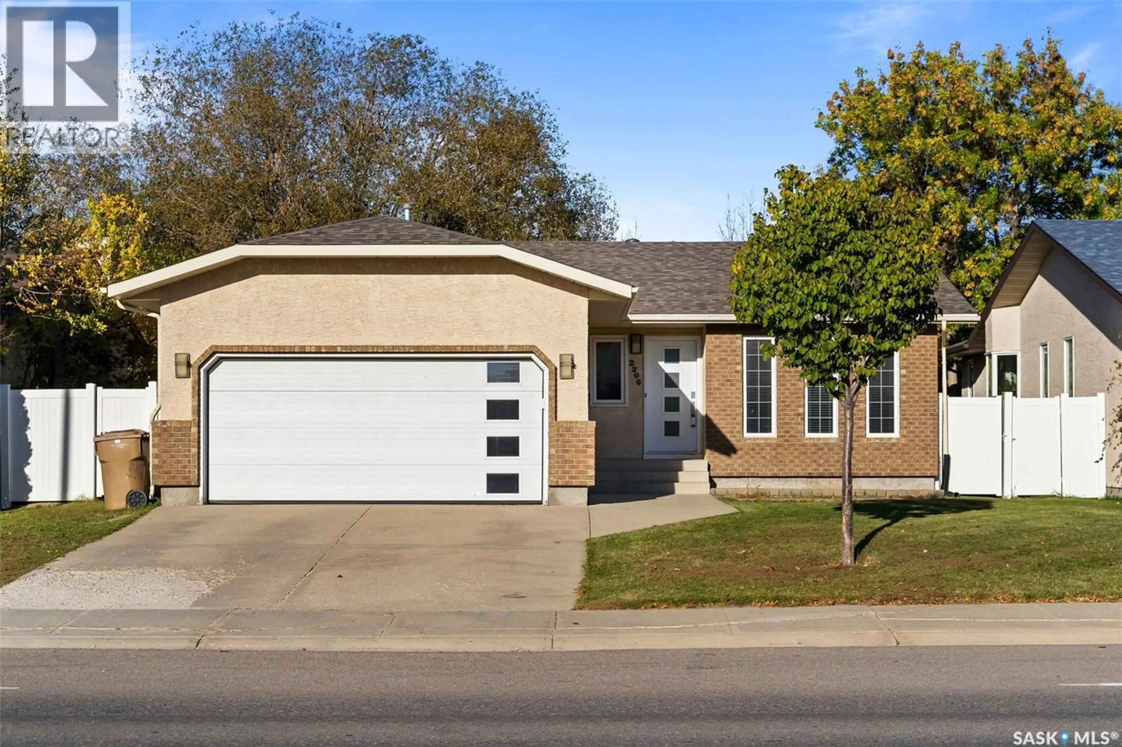 Home with brick exterior material, street for 2206 ASSINIBOINE AVENUE, Regina Saskatchewan S4V2E8