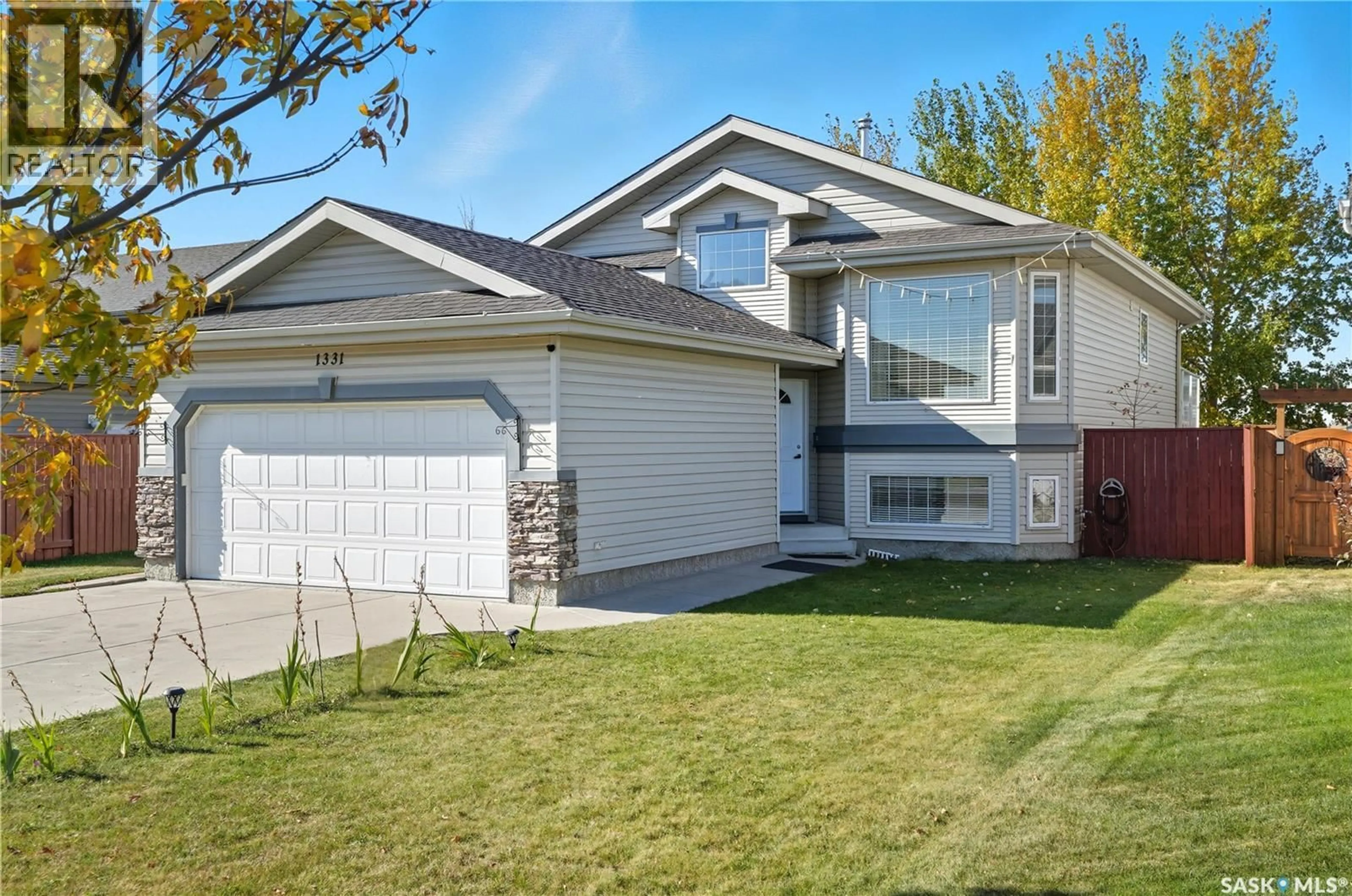 Home with vinyl exterior material, street for 1331 HUGHES DRIVE, Saskatoon Saskatchewan S7L7N1