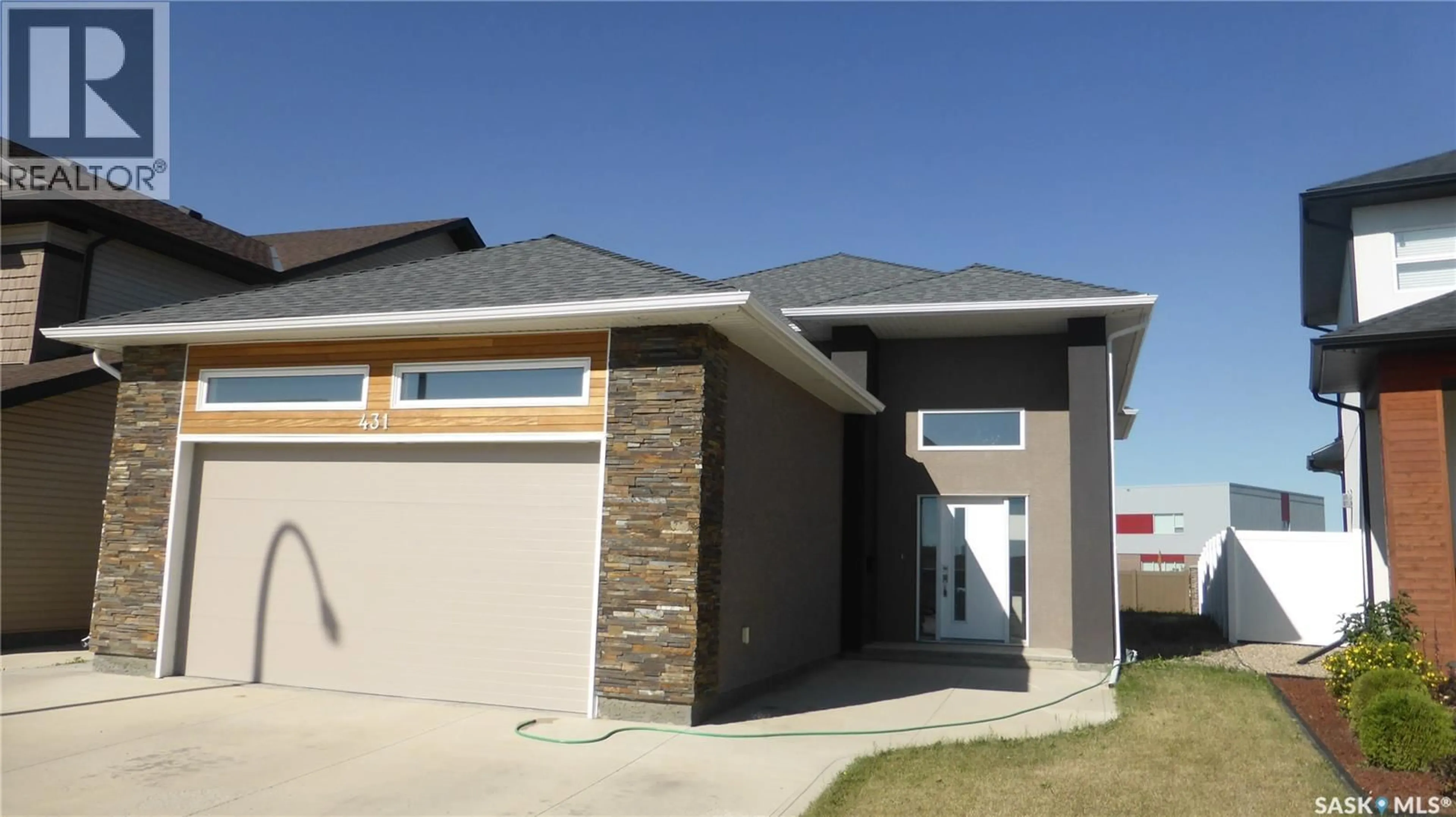 Home with brick exterior material, street for 431 FLYNN LANE, Saskatoon Saskatchewan S7V0J8