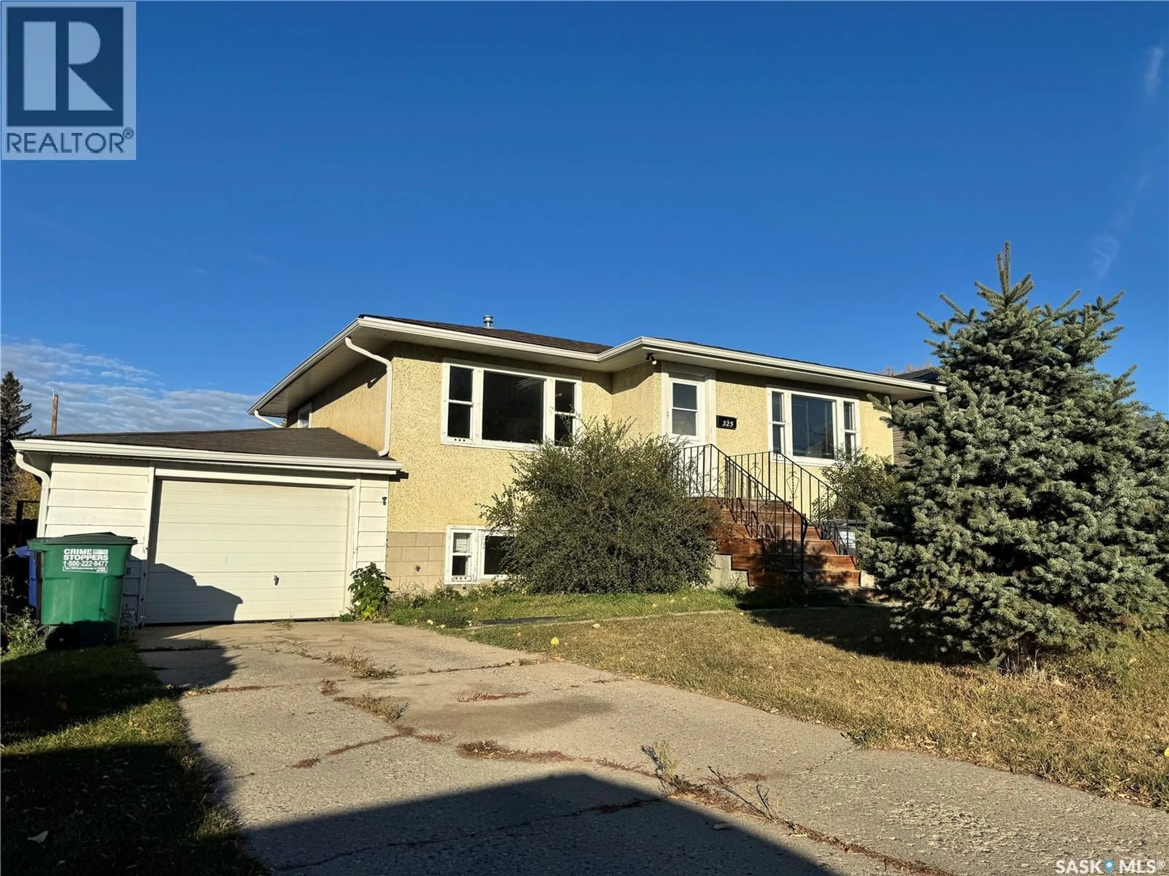 Home with vinyl exterior material, street for 325 V AVENUE, Saskatoon Saskatchewan S7M3E4