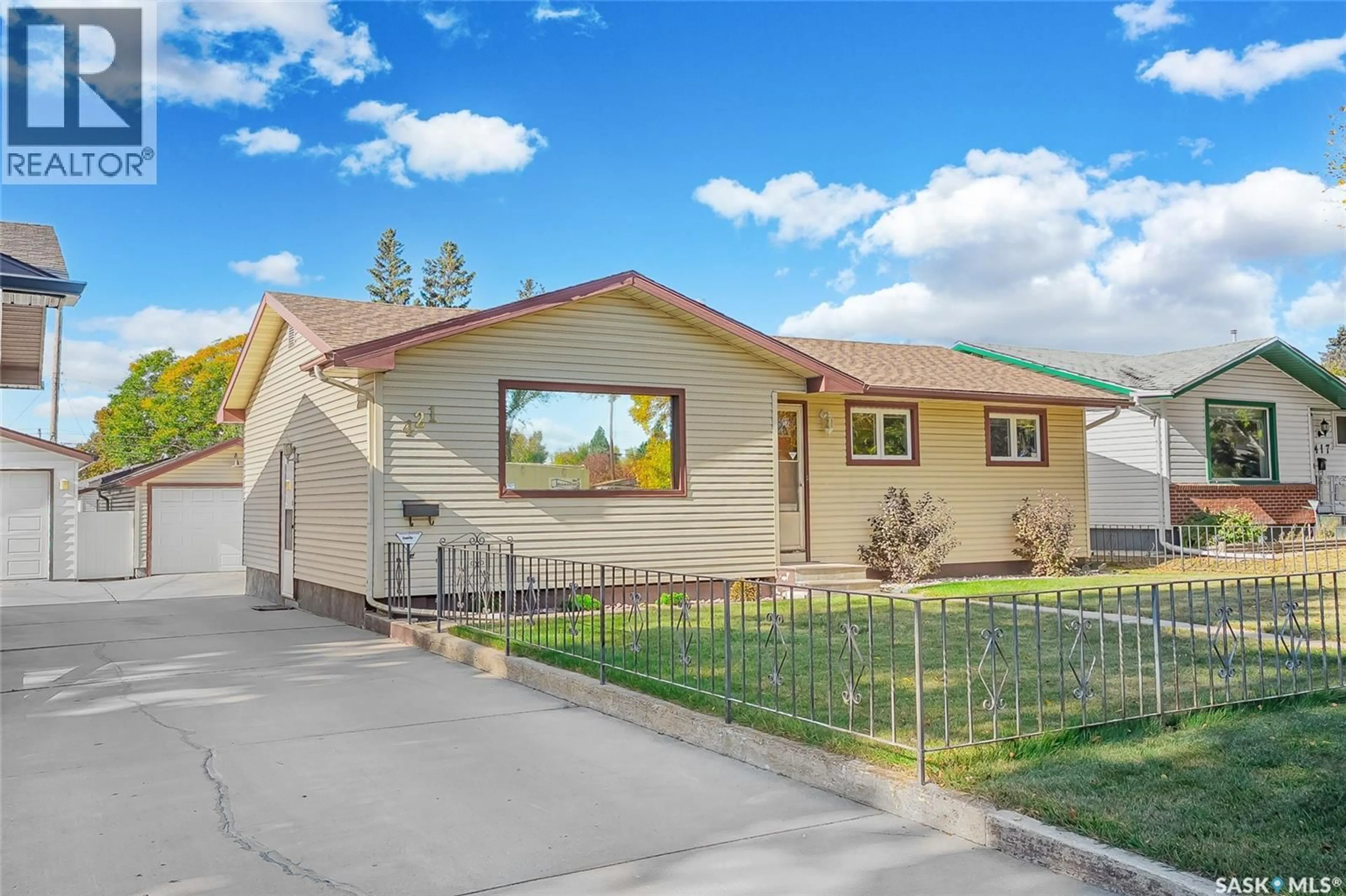 Home with vinyl exterior material, street for 421 WINNIPEG AVENUE, Saskatoon Saskatchewan S7M3M6