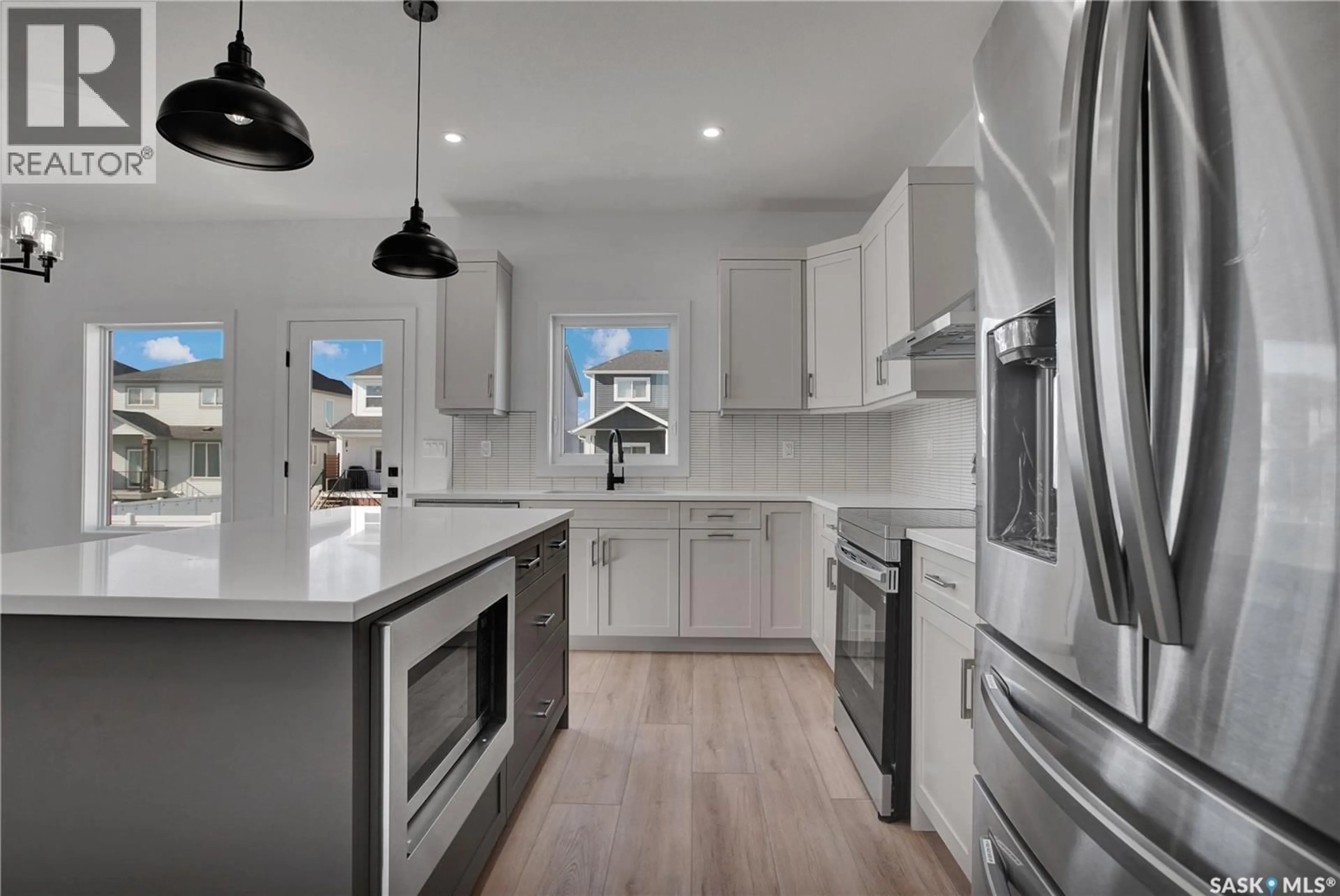 Open concept kitchen, ceramic/tile floor for 114 HAVERSTOCK CRESCENT, Saskatoon Saskatchewan S7W1E2