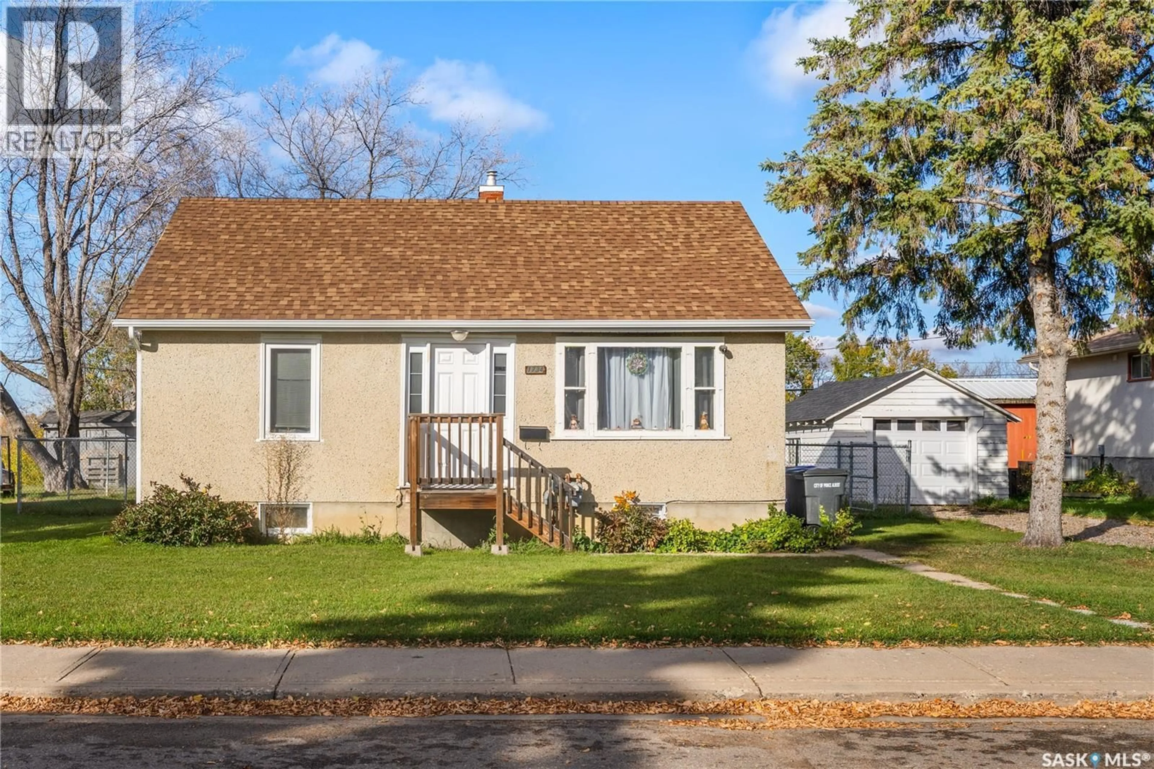 Home with vinyl exterior material, street for 1734 13TH STREET, Prince Albert Saskatchewan S6V3K1