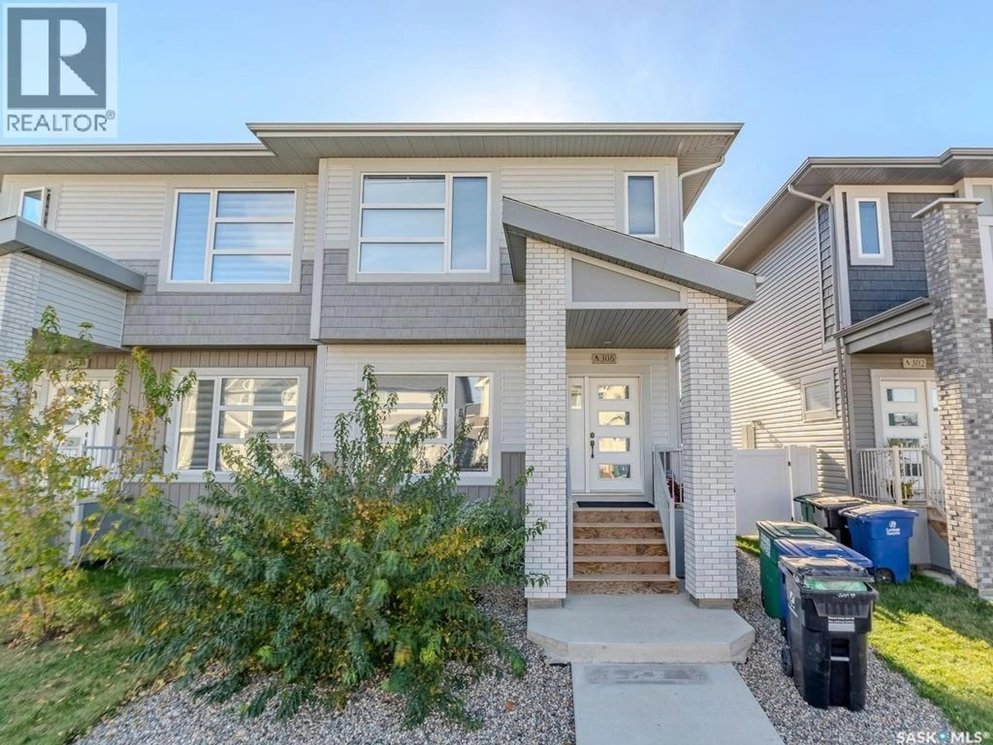Home with brick exterior material, street for 306 BRIGHTON BOULEVARD, Saskatoon Saskatchewan S7V0V8