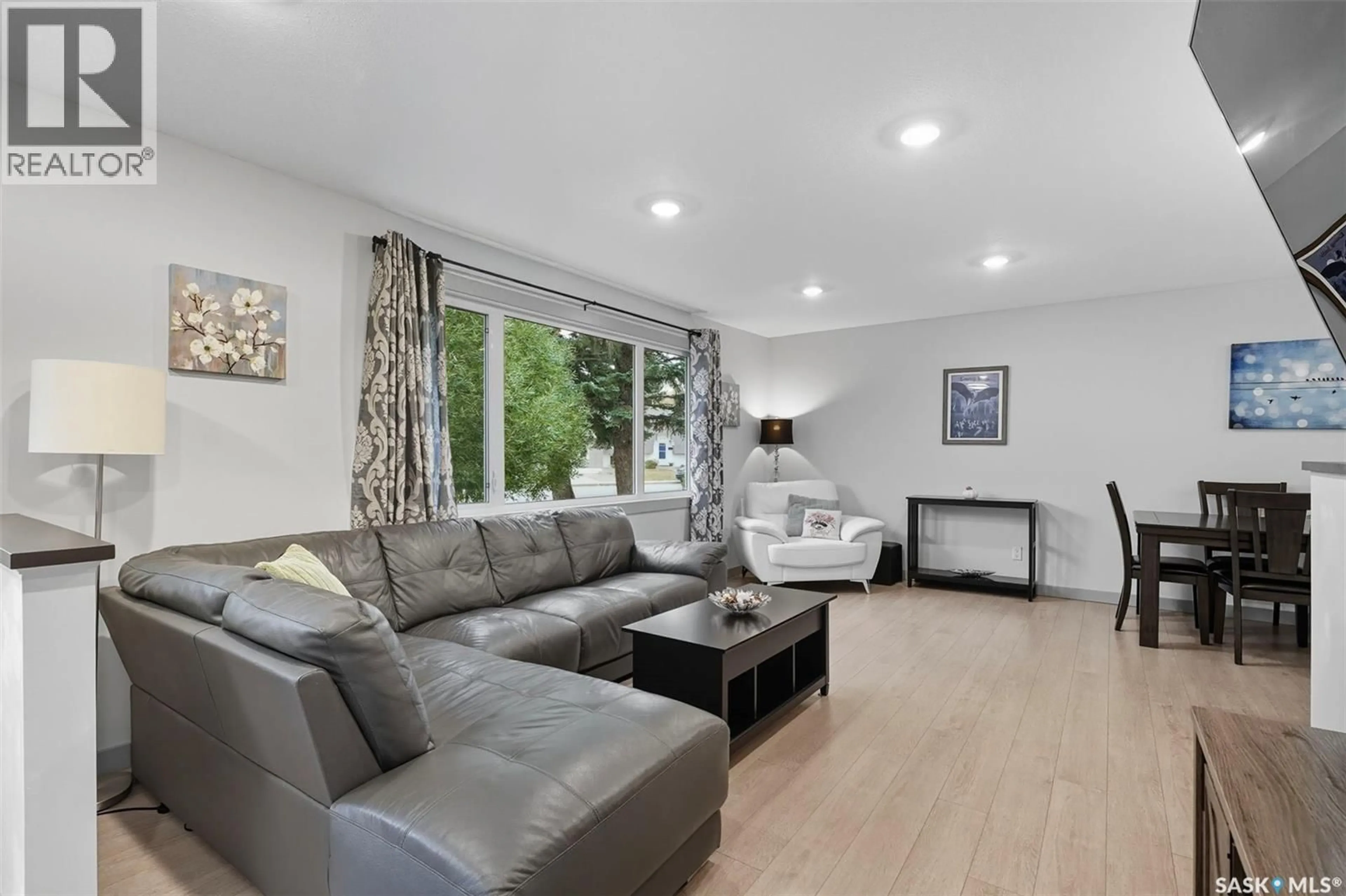 Living room with furniture, wood/laminate floor for 148 ST LAWRENCE CRESCENT, Saskatoon Saskatchewan S7K3V8