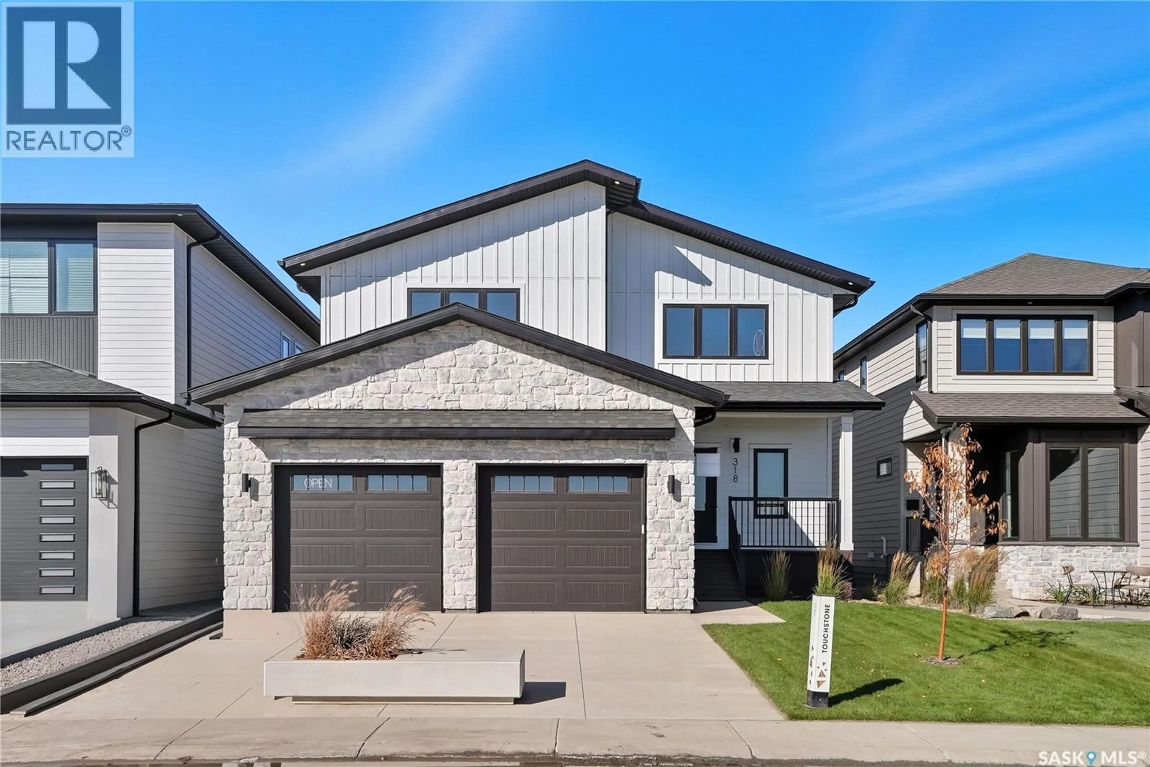 Home with brick exterior material, street for 318 TAUBE GREEN, Saskatoon Saskatchewan S7V1M4