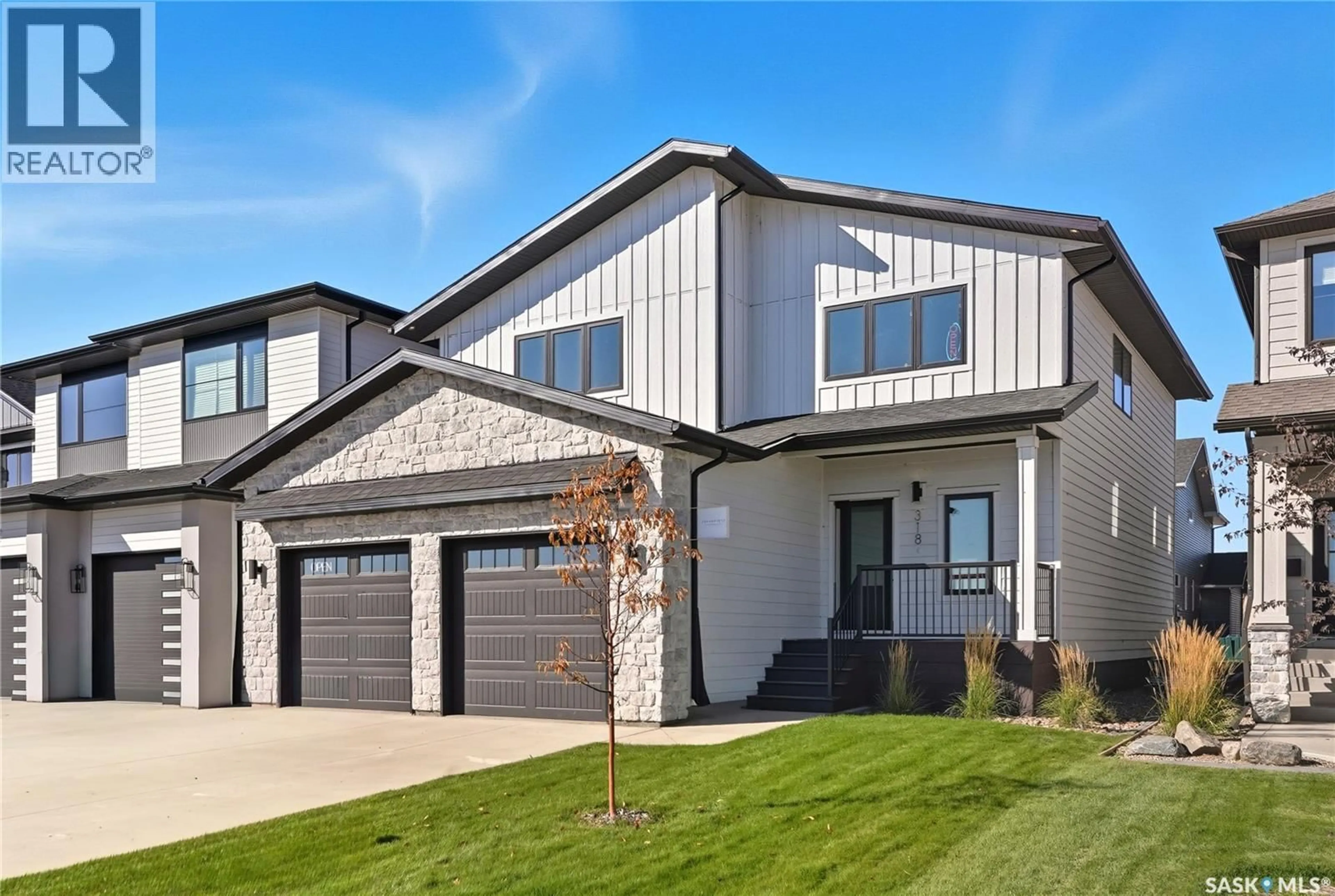Home with brick exterior material, street for 318 TAUBE GREEN, Saskatoon Saskatchewan S7V1M4