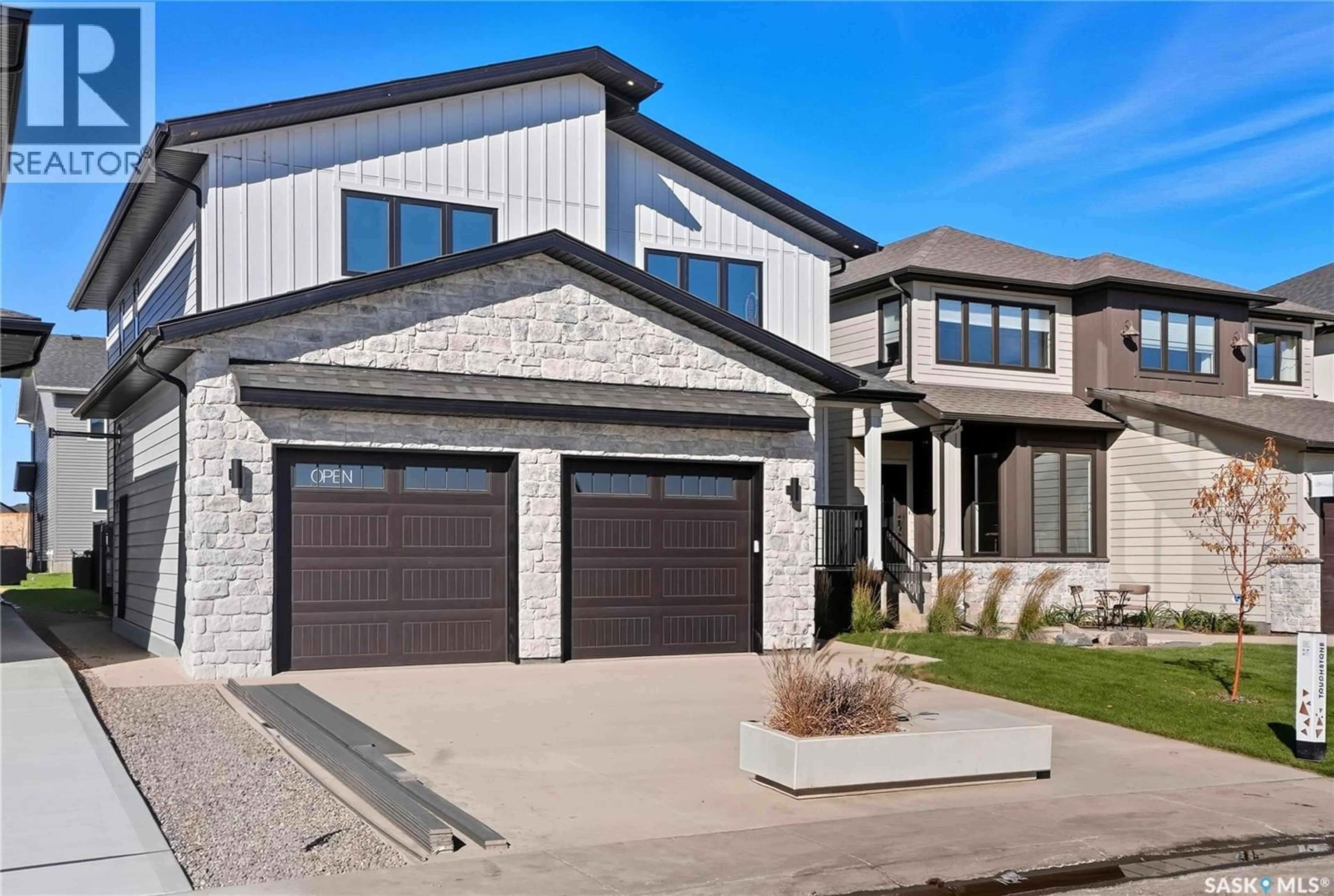 Home with brick exterior material, street for 318 TAUBE GREEN, Saskatoon Saskatchewan S7V1M4