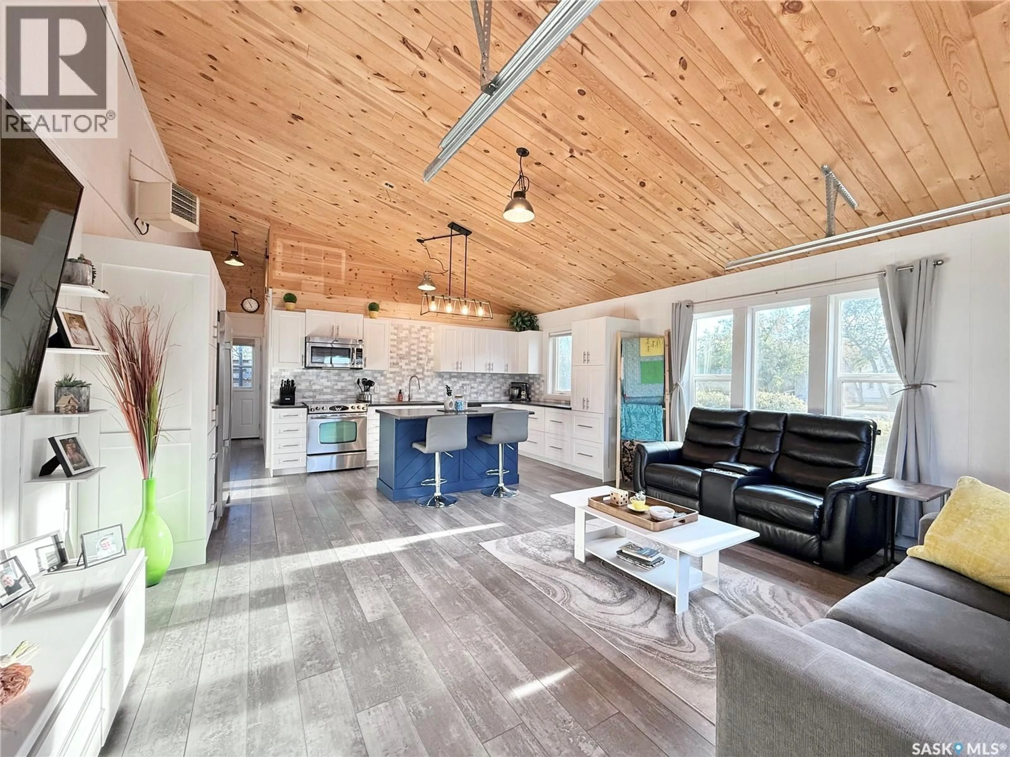 Open concept kitchen, wood/laminate floor for 209 2ND STREET, Milden Saskatchewan S0L2L0
