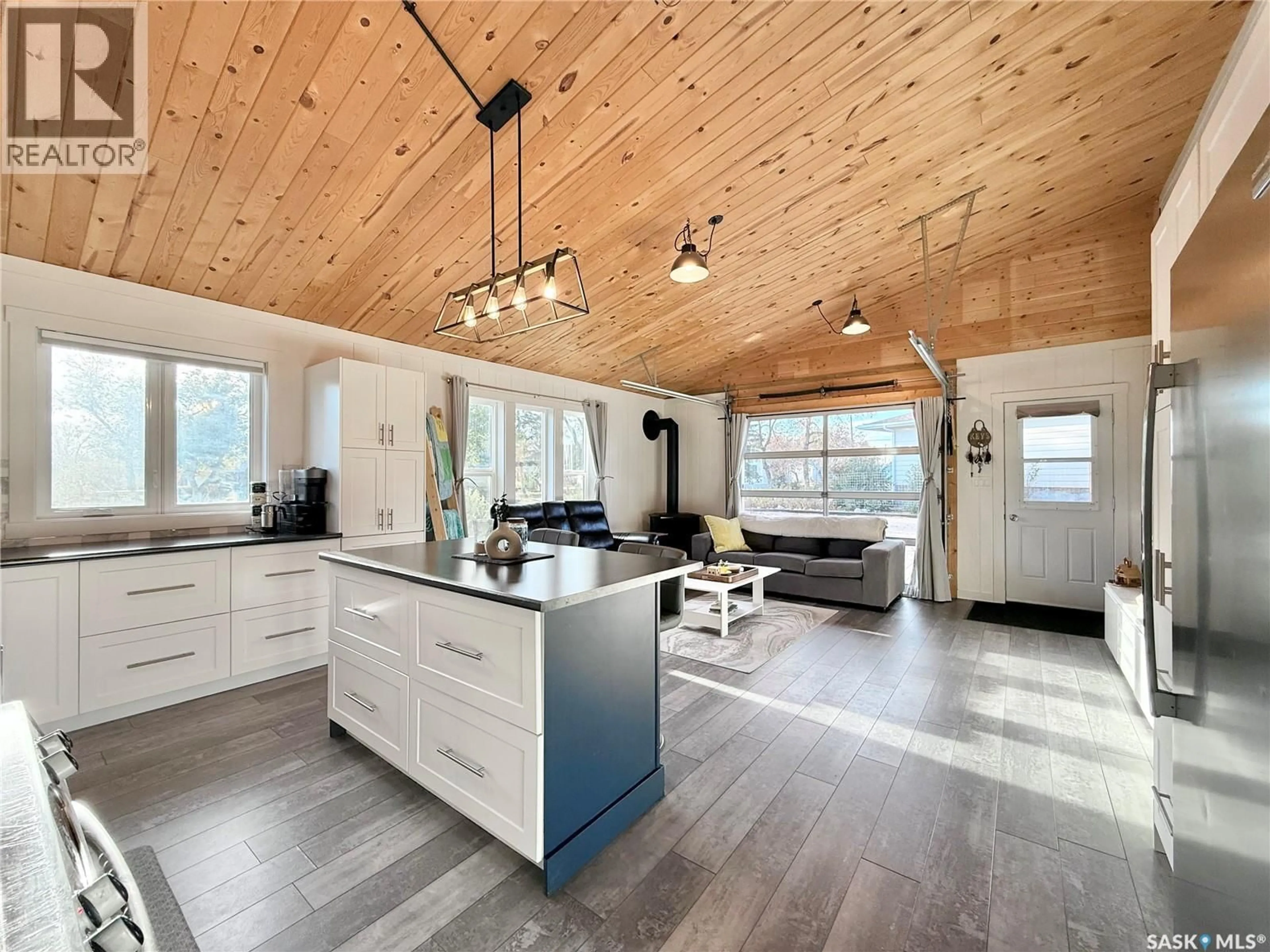 Open concept kitchen, wood/laminate floor for 209 2ND STREET, Milden Saskatchewan S0L2L0